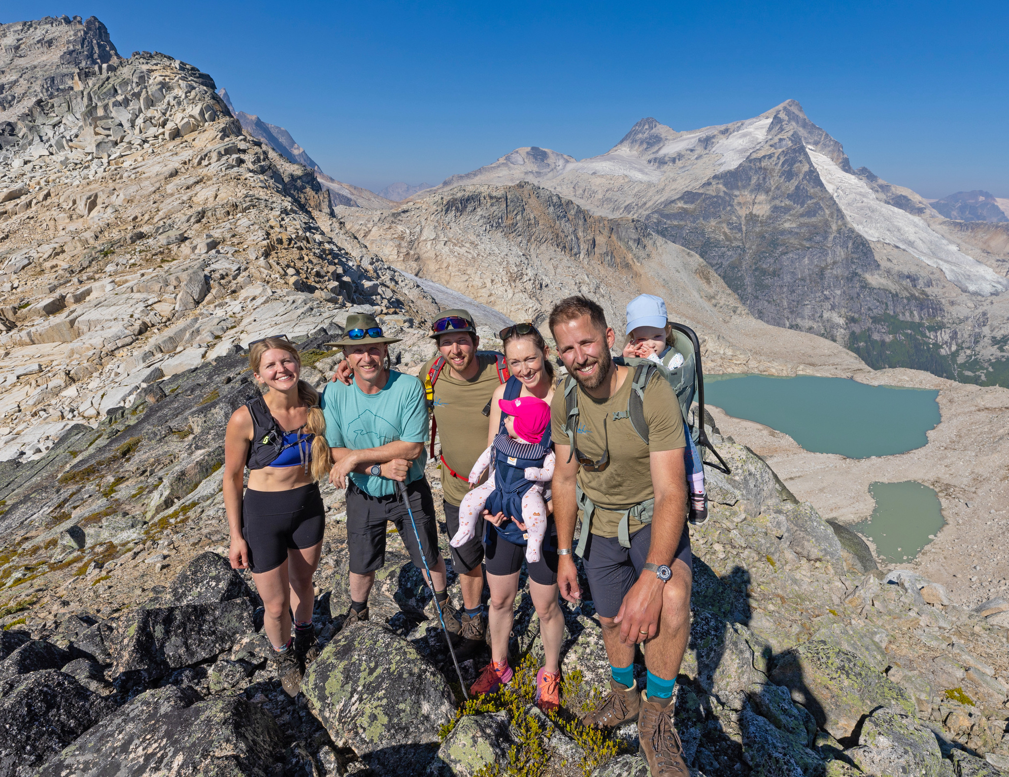A group on the summit, two little ones along in carriers