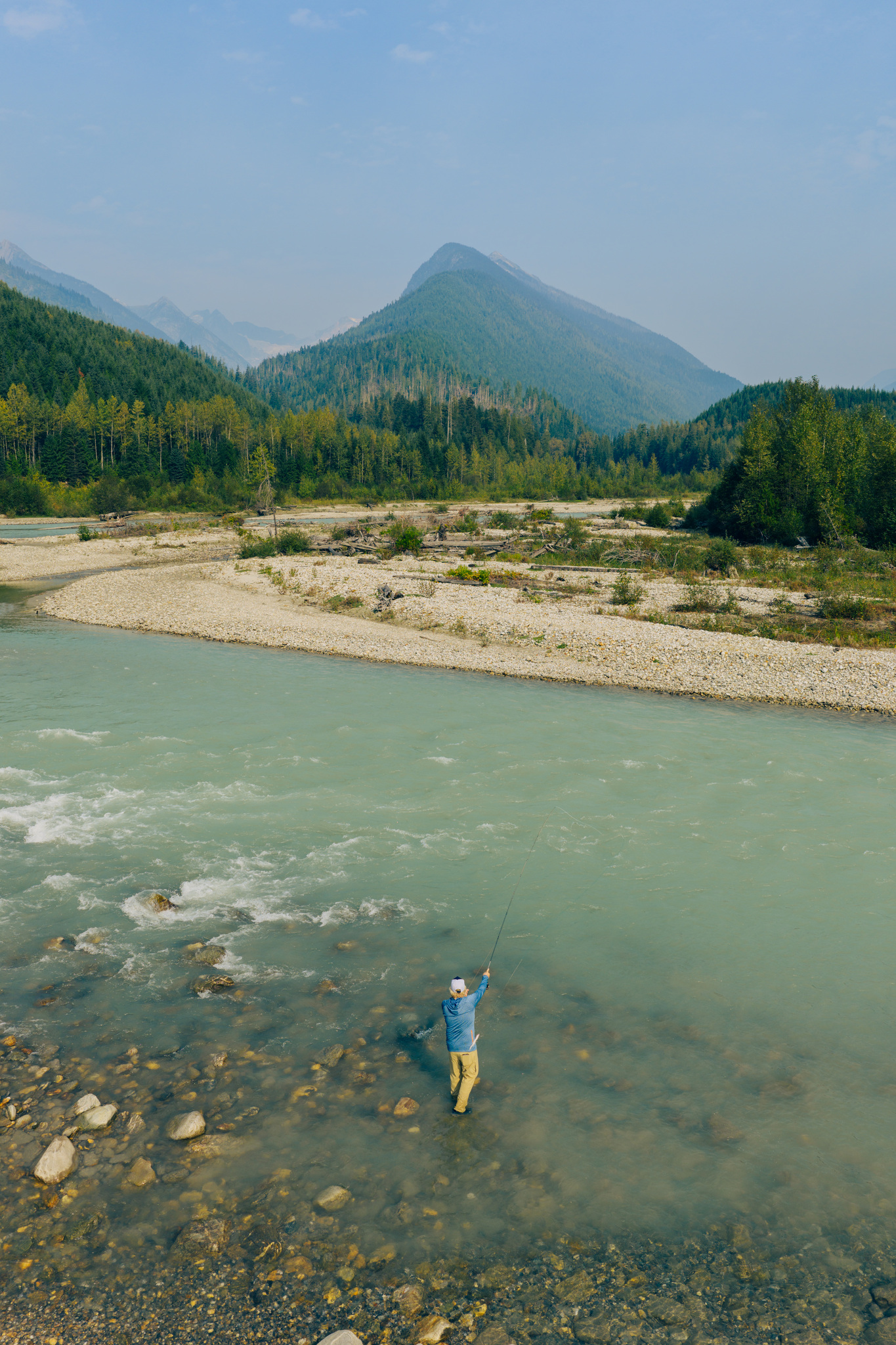 Casting in the shallows of a wide river