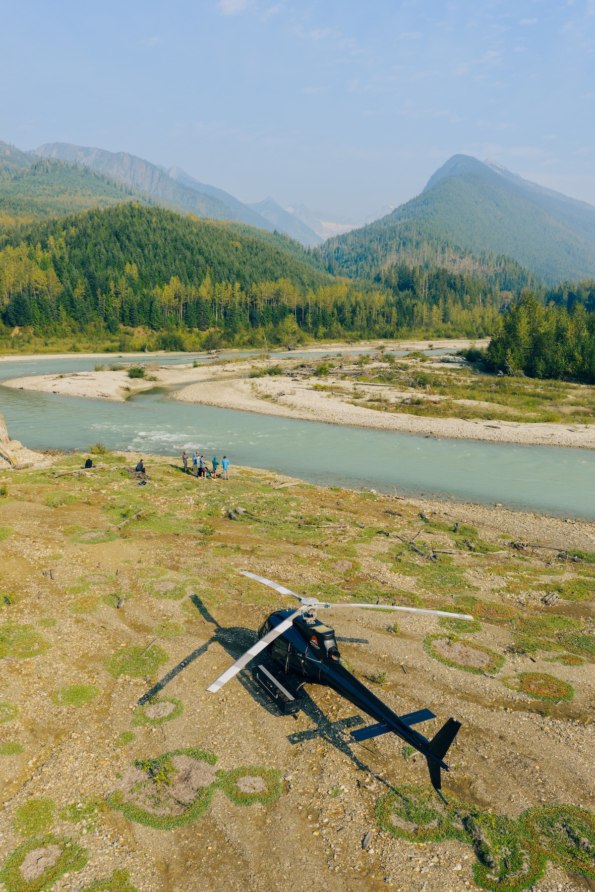 The helicopter set down beside the river
