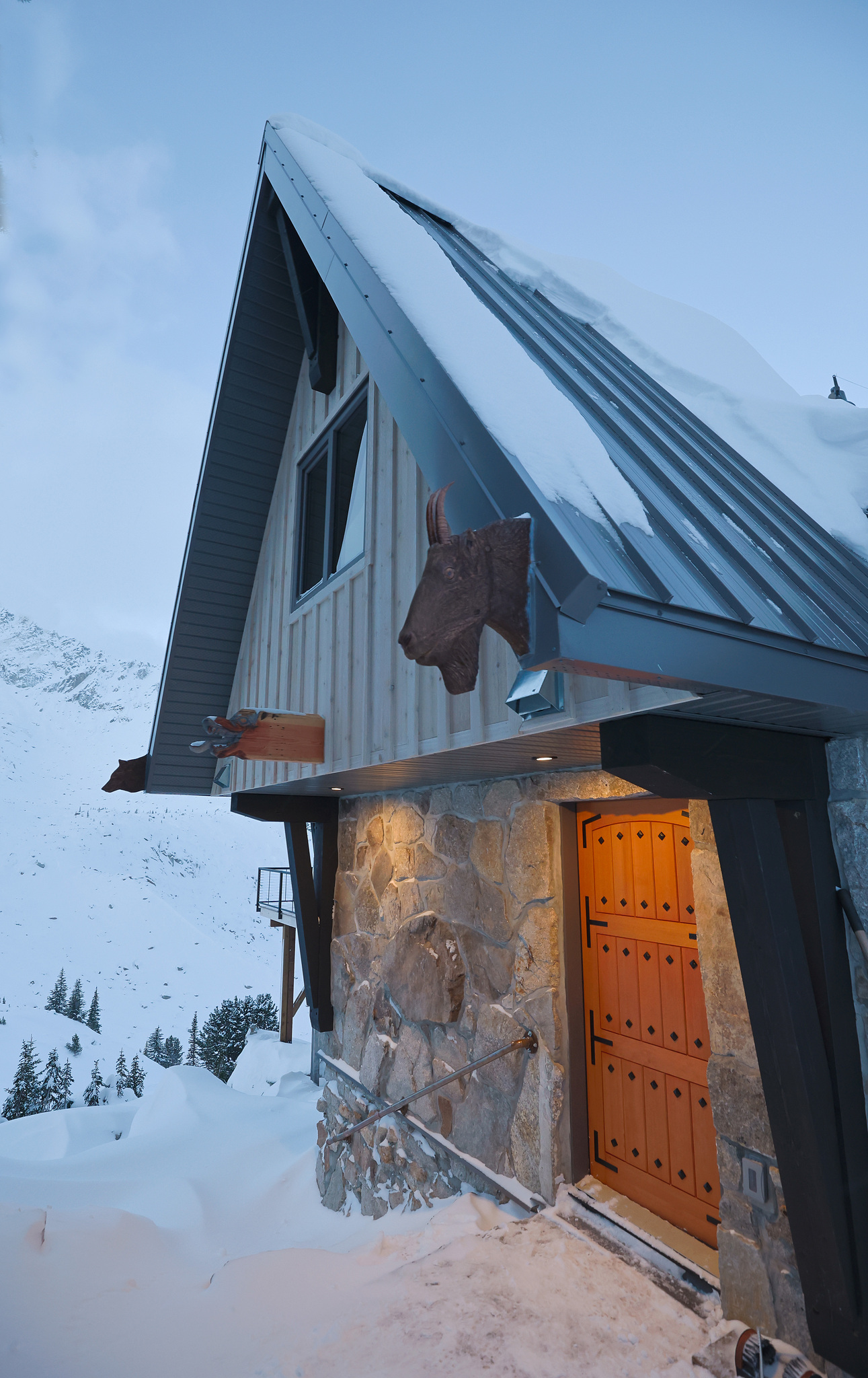 The lodge's stone entrance, deep in snow