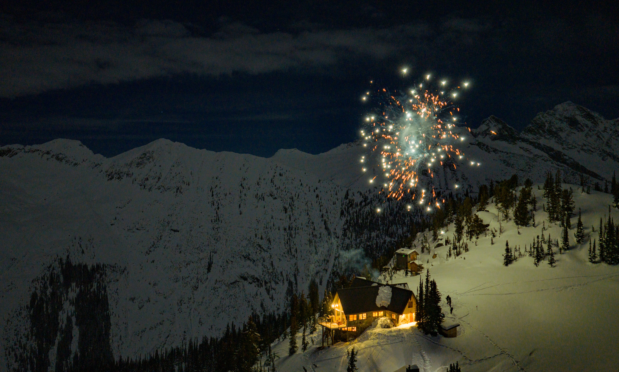 Fireworks over the lodge on a winter night