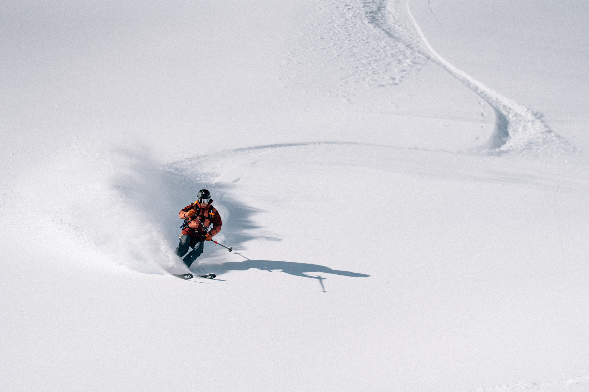 A deep powder turn beside the skin track