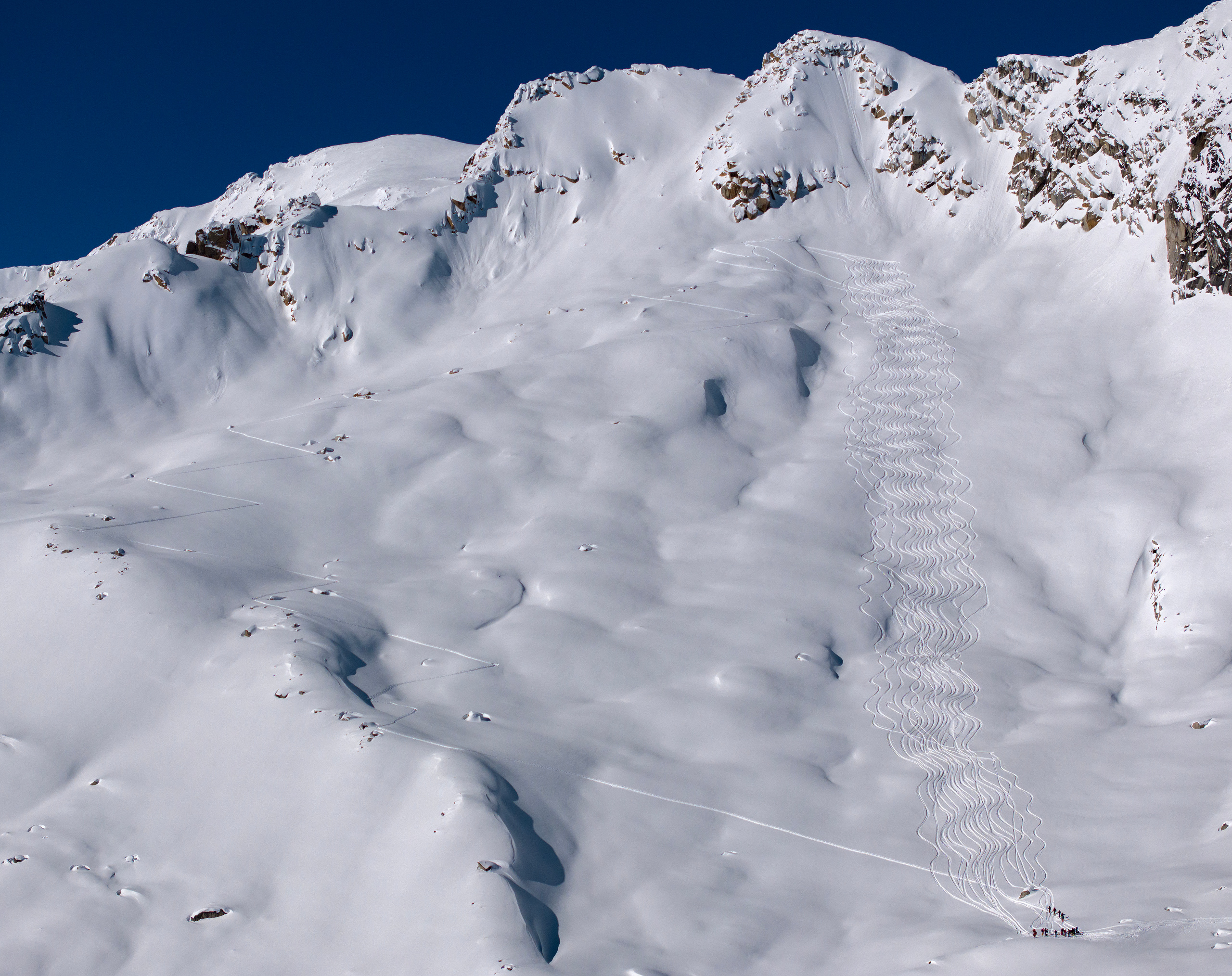 Ski tracks down an untouched Selkirk slope