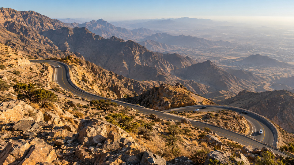 Mountain-road vista at the Al Hada escarpment near Taif; original destination visualization