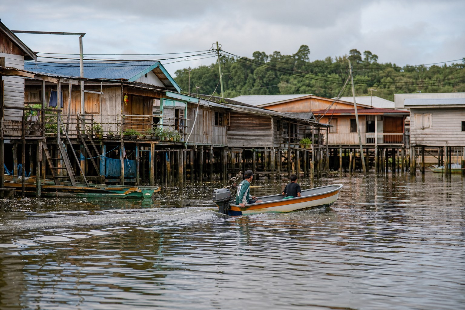 Stilt houses and boardwalks of the Kampong Ayer water village on the Brunei River