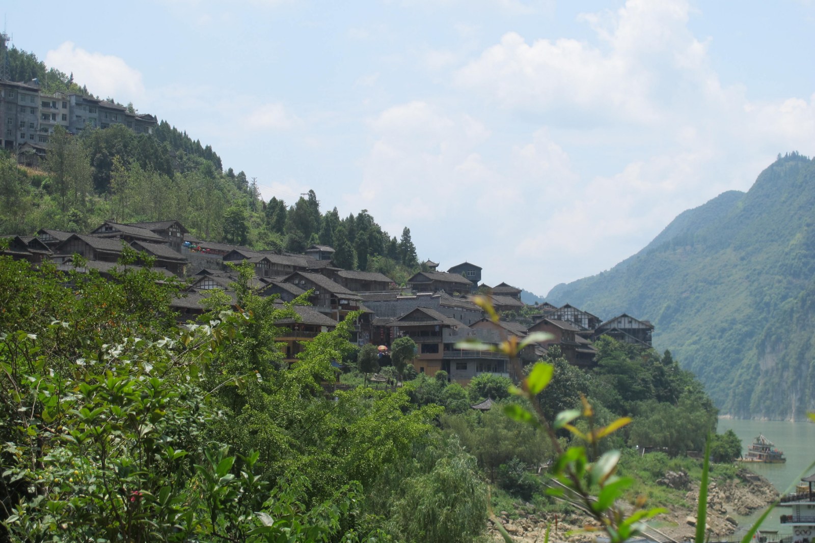 Gongtan Ancient Town climbing the wooded bank of the Wu River