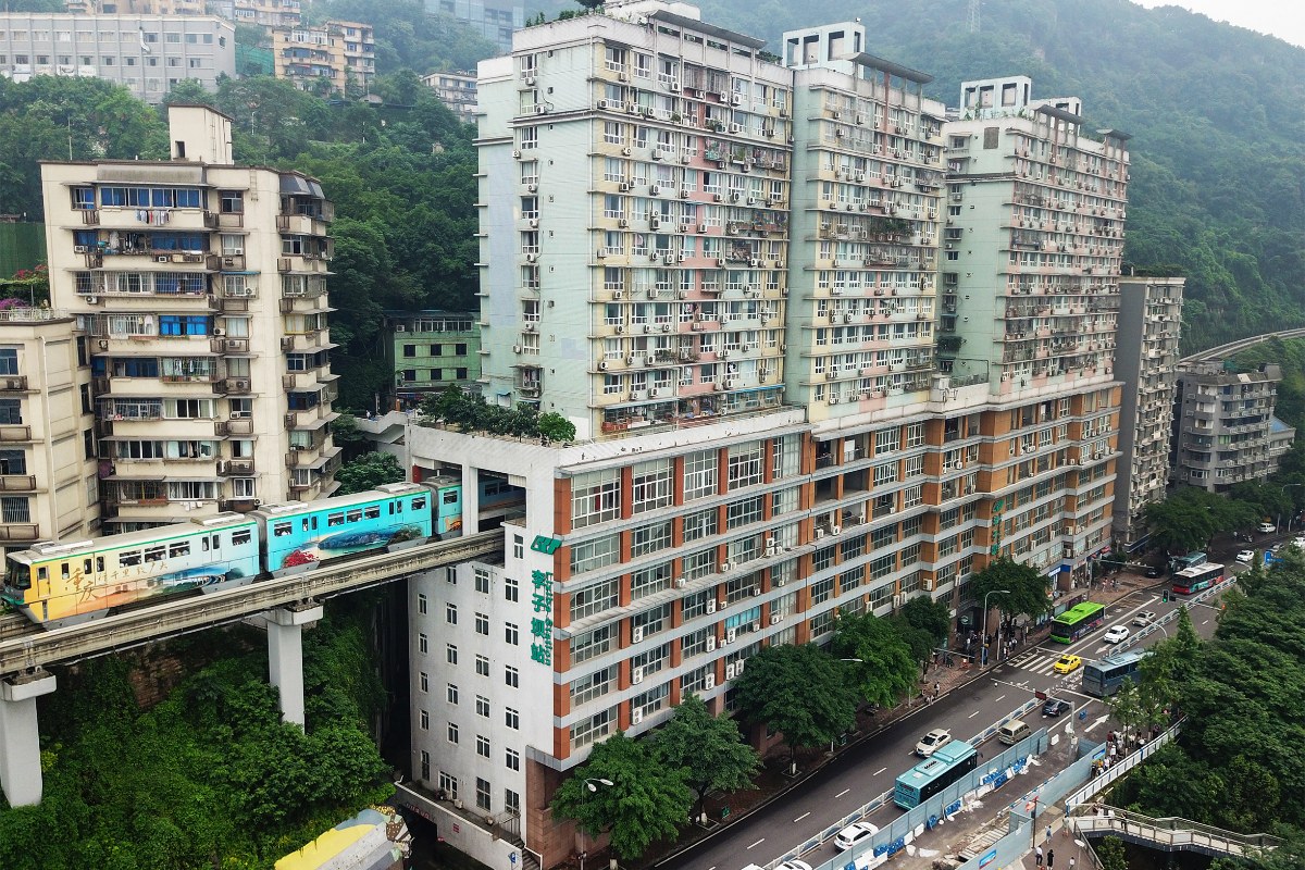 A Chongqing Rail Transit train entering the residential tower at Liziba Station