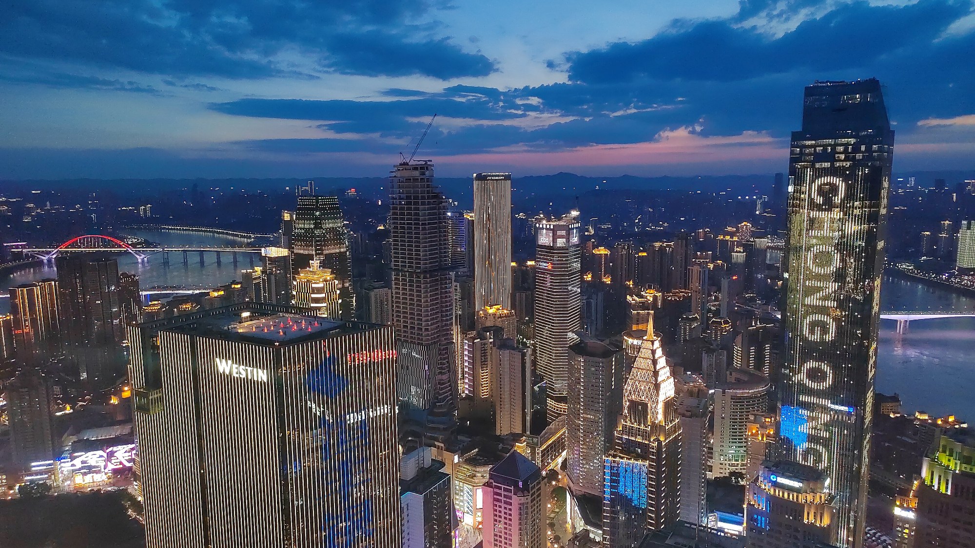 Yuzhong District and the Chongqing riverfront illuminated at blue hour