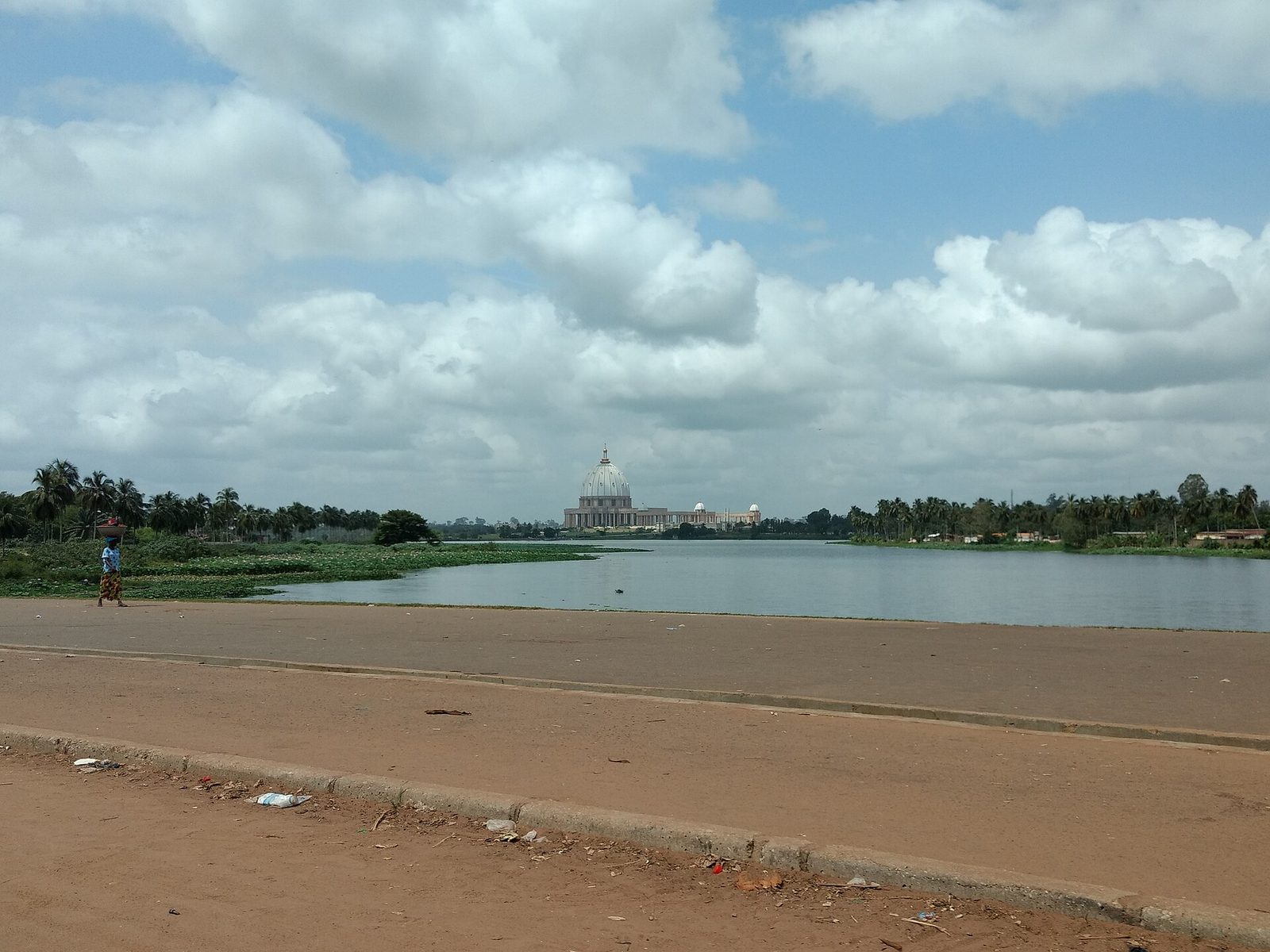 The Basilica of Our Lady of Peace rising over the lake at Yamoussoukro, Côte d'Ivoire