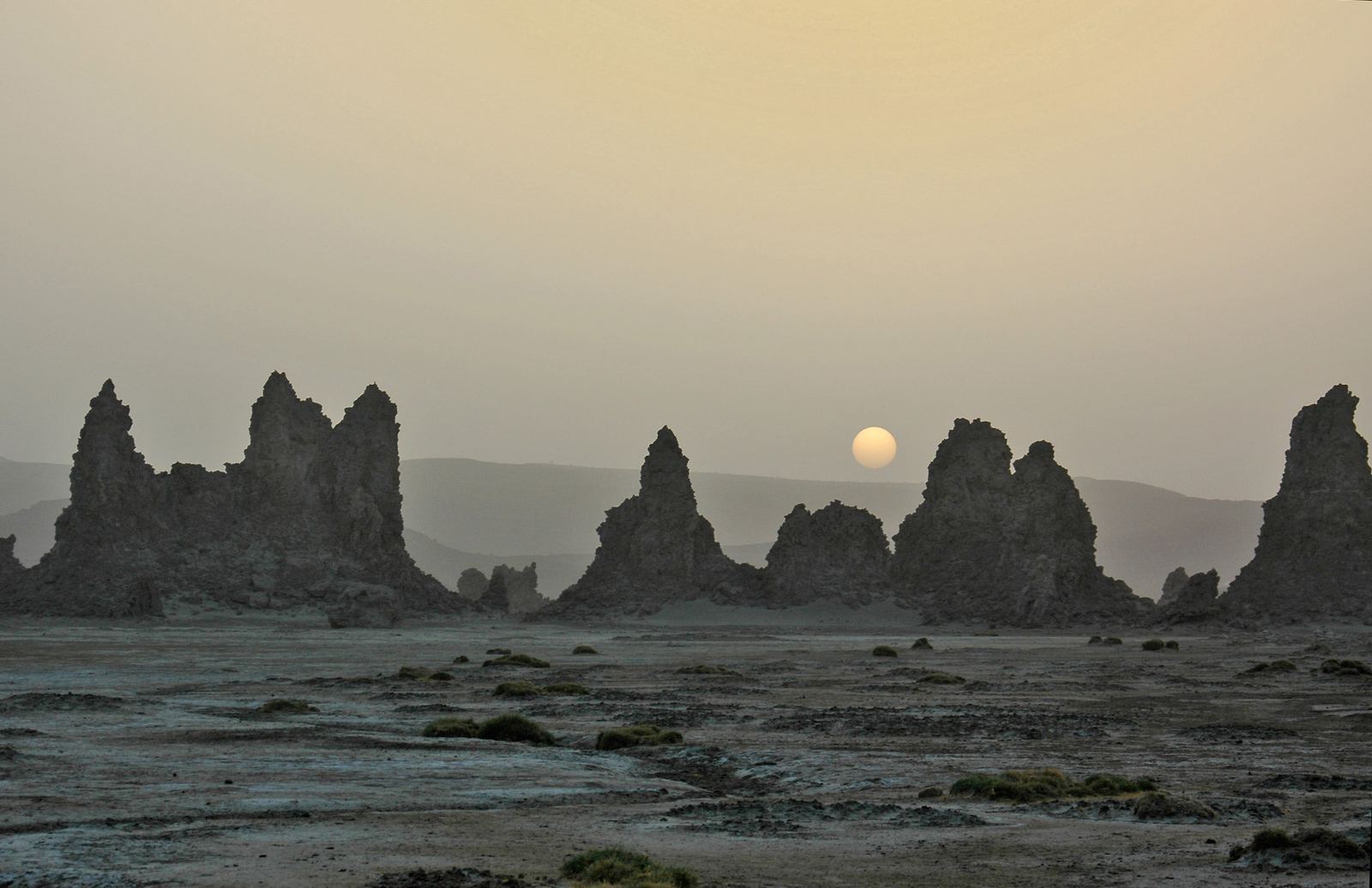 The limestone chimneys of Lake Abbe steaming at dawn, Djibouti