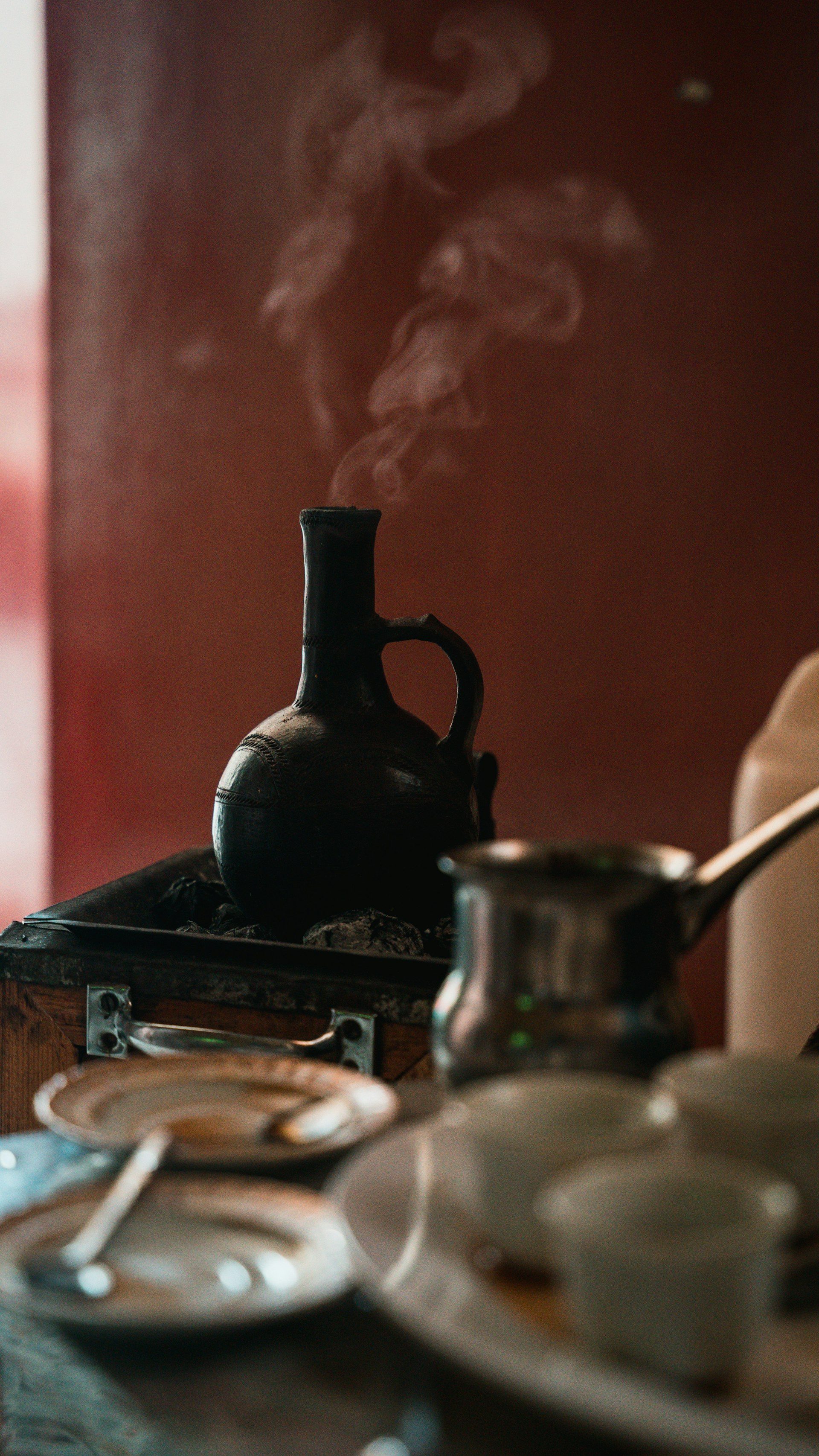Traditional Eritrean coffee ceremony with jebena and incense