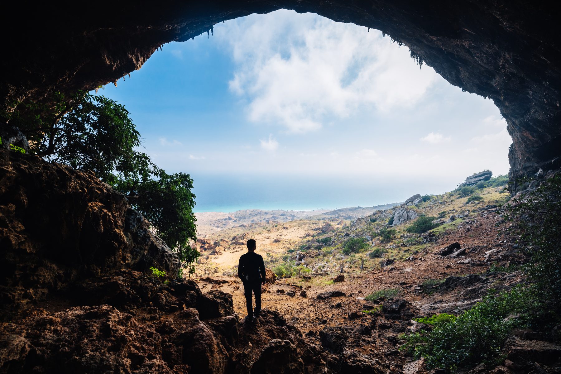Silhouette at the mouth of Hoq Cave looking out toward the Arabian Sea, Socotra Island