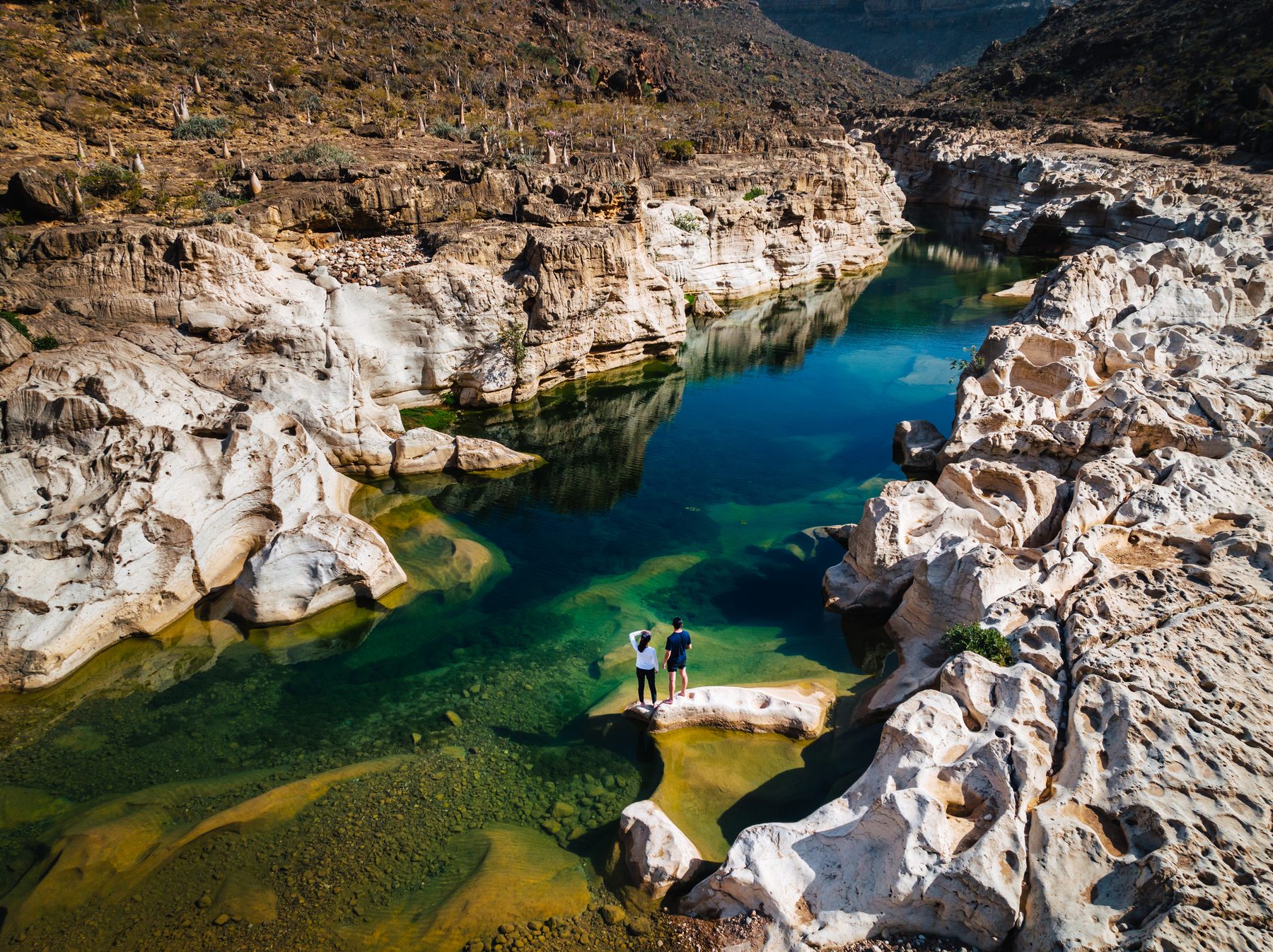 Aerial view of Kalisan Canyon’s turquoise freshwater pools, Socotra Island