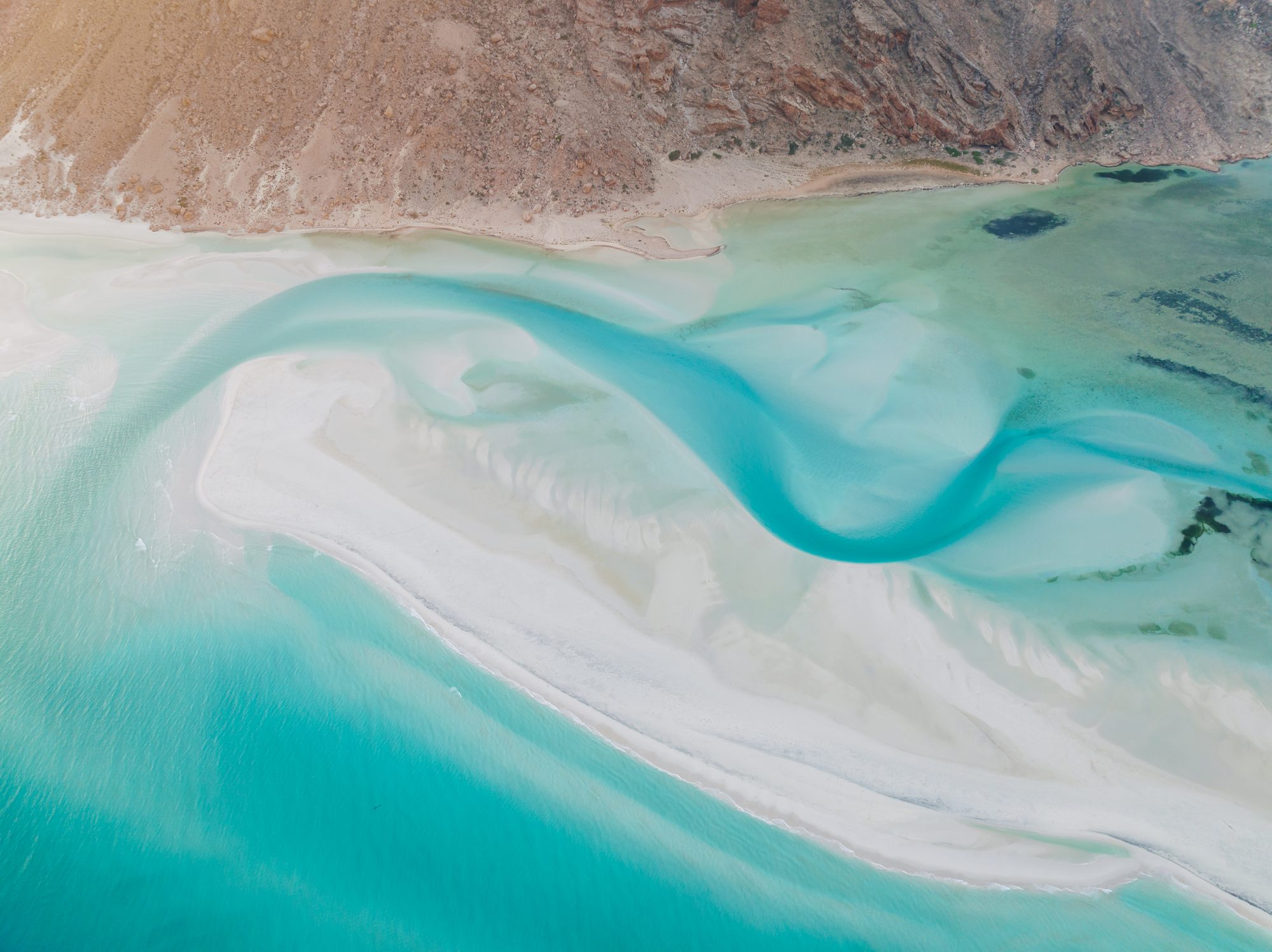 Aerial view of Shu’ab Beach with turquoise waters and white-sand peninsula, Socotra Island