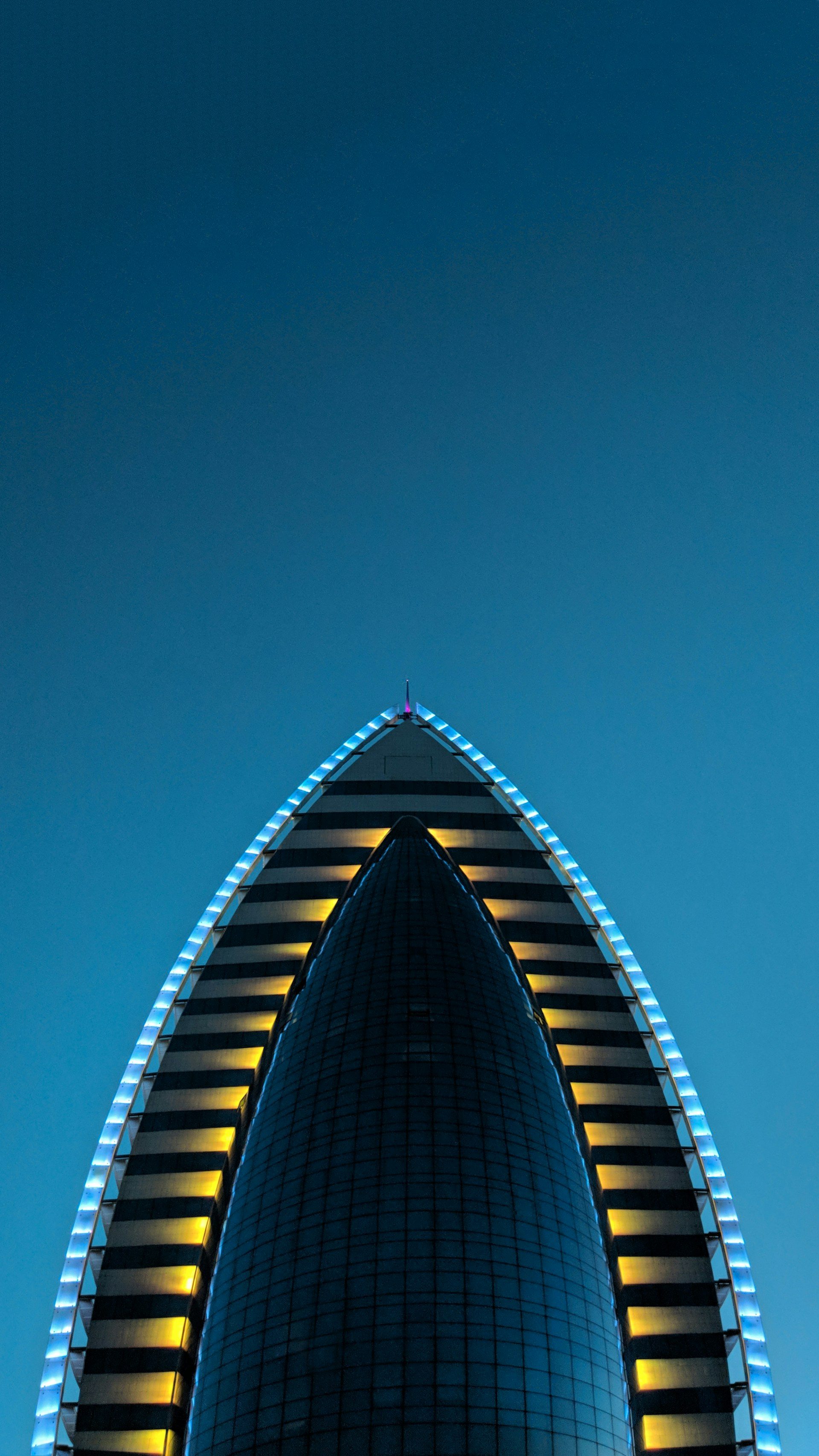 Illuminated modern tower in Ashgabat at dusk, Turkmenistan