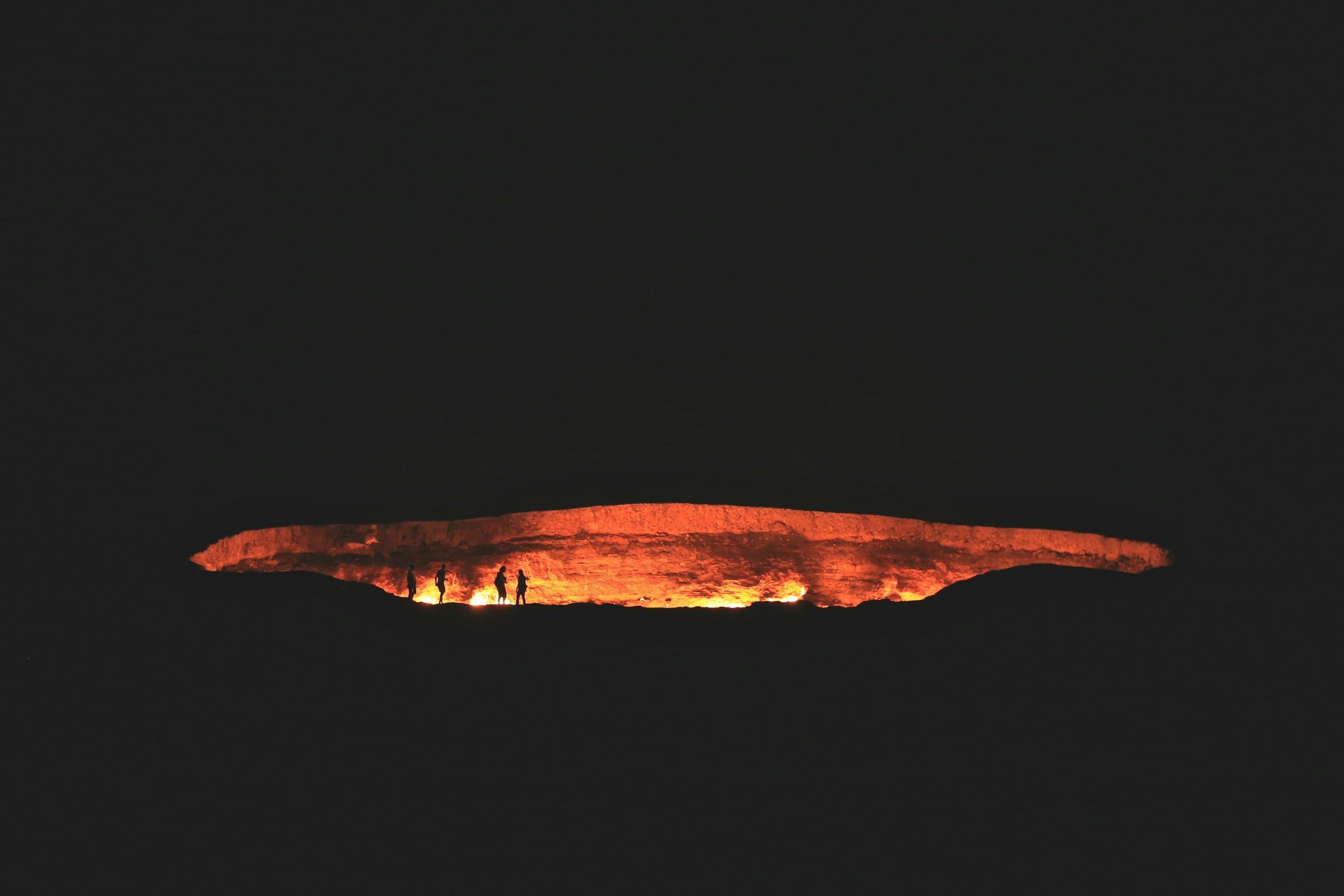 The Darvaza Gas Crater (Door to Hell) burning at night in Turkmenistan
