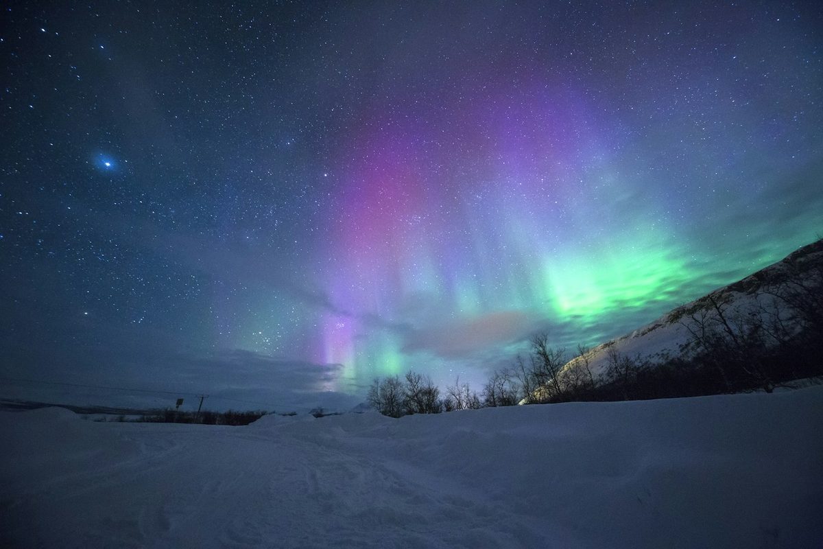 Northern lights aurora borealis over expedition landscape