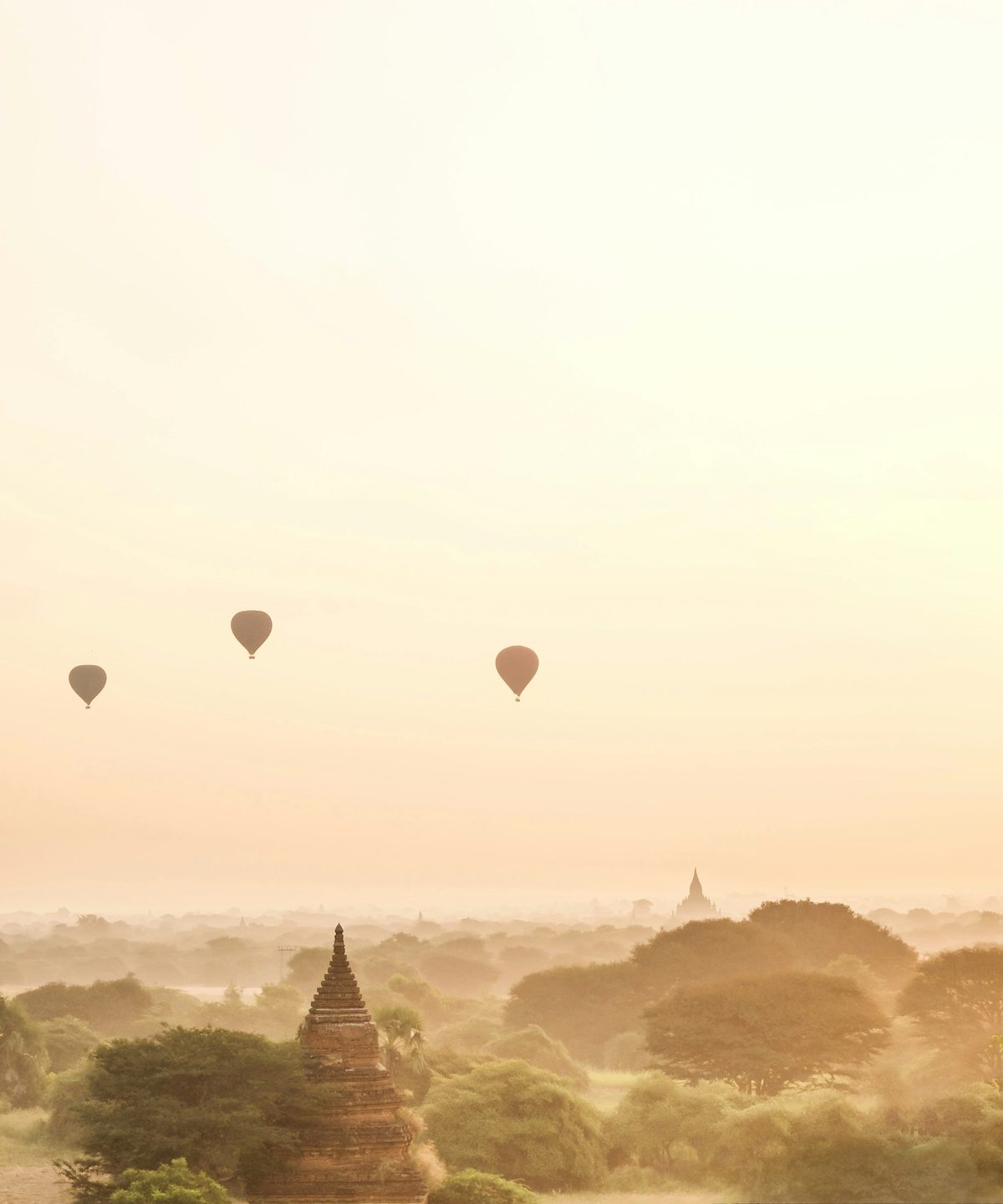 Silhouette of hot air balloons over Bagan at sunrise