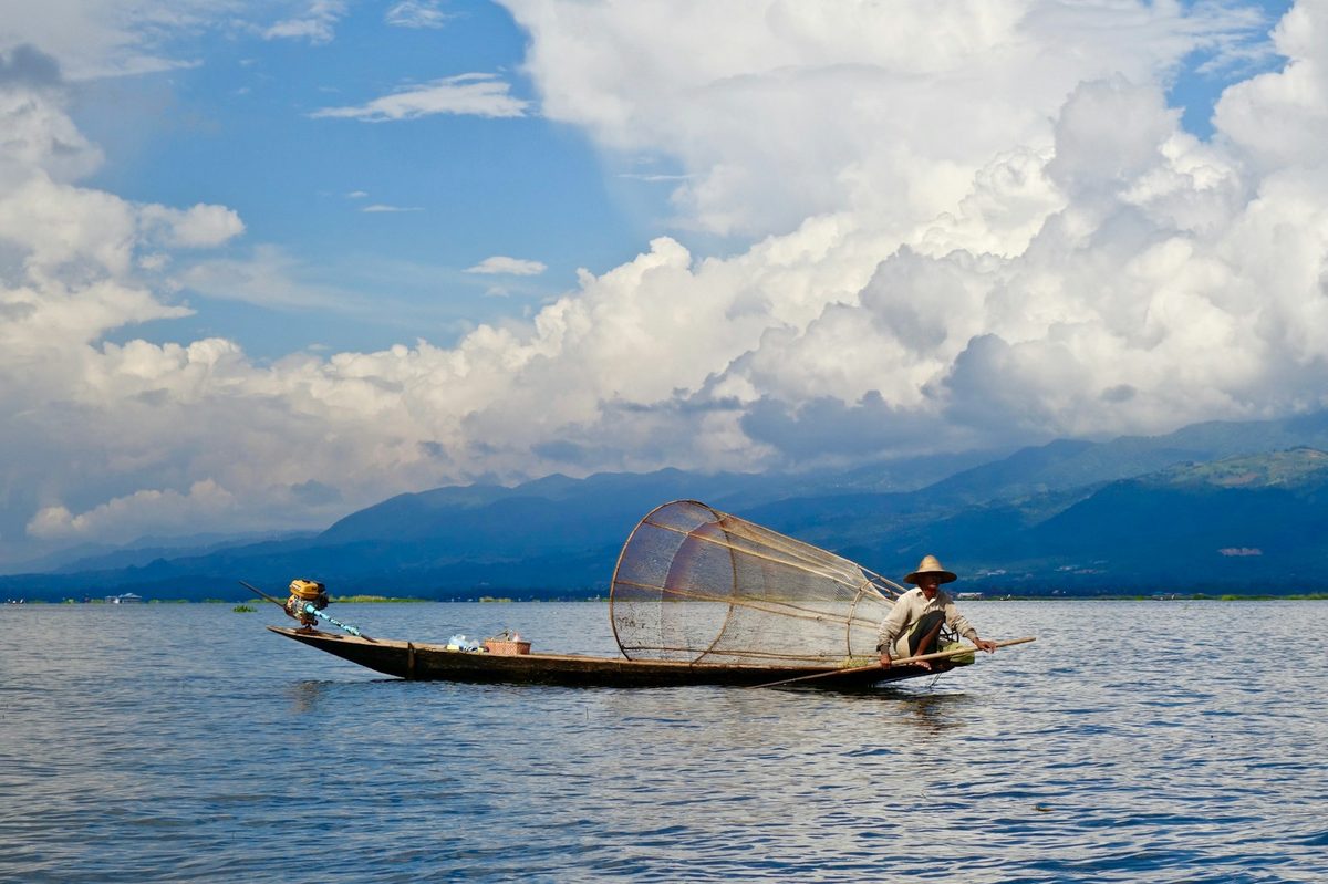 Intha fisherman one-leg rowing on Inle Lake, Myanmar
