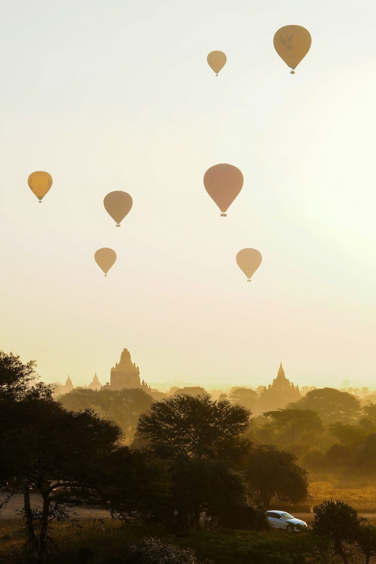 Pink hot air balloons at sunrise over Bagan temples, Myanmar