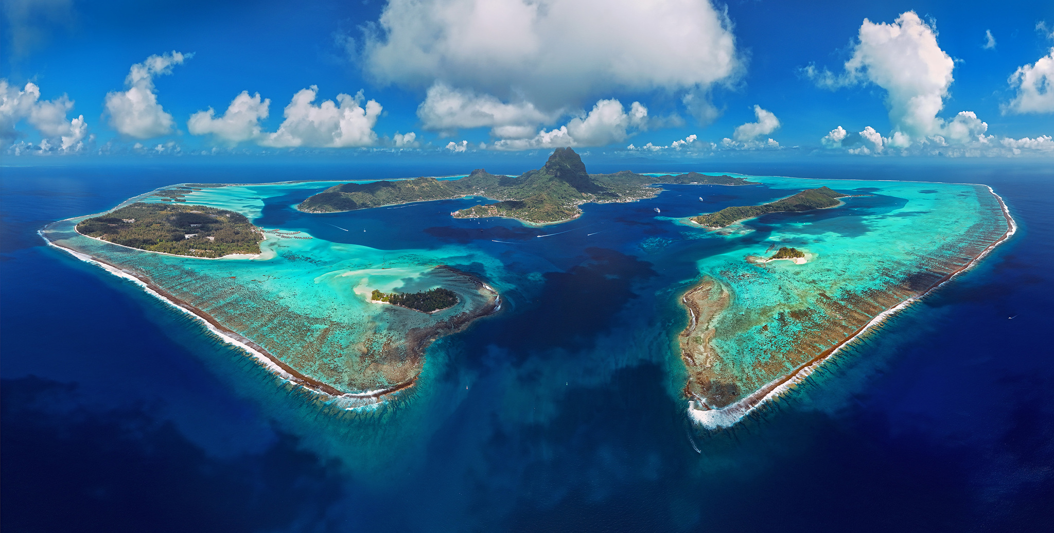 Bora Bora inside its ring of reef and lagoon, from the air