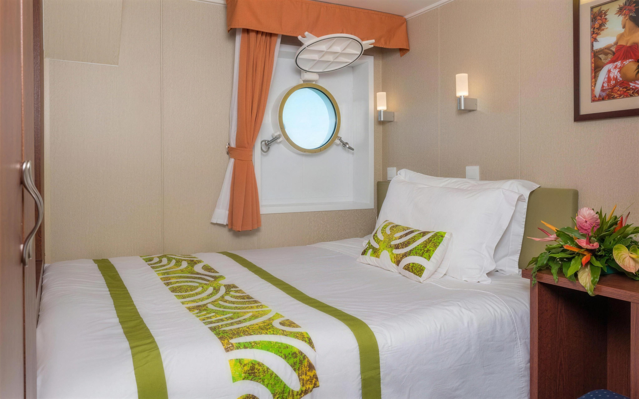 A Single Stateroom, with a single bed under a porthole