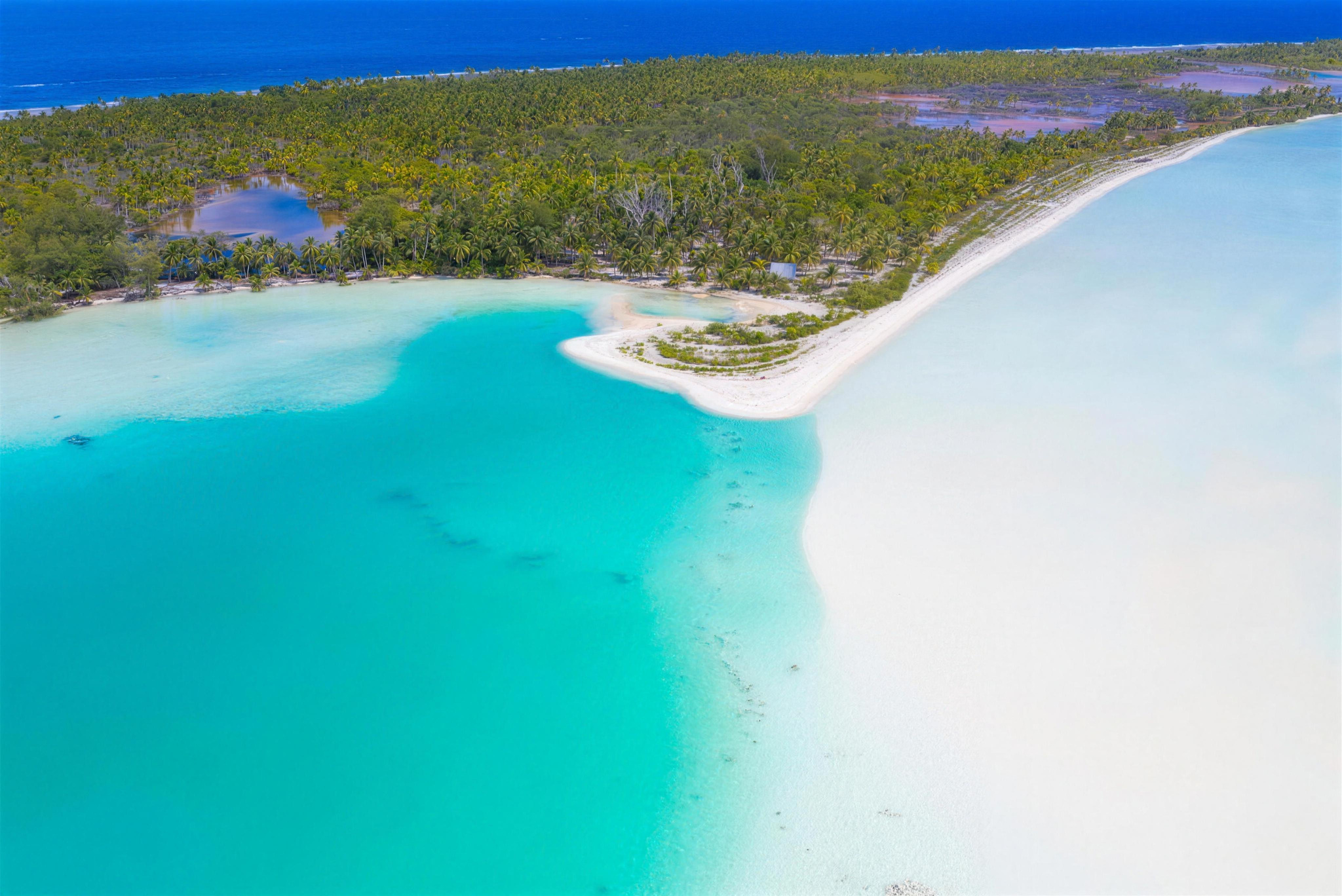 A white sand spit and turquoise shallows on Fakarava, from the air