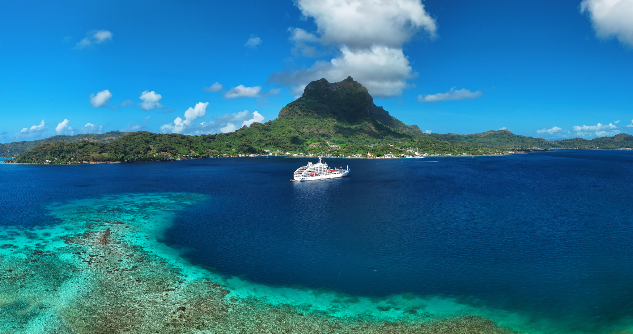 Aranui 5 at anchor in the Bora Bora lagoon below Mount Otemanu