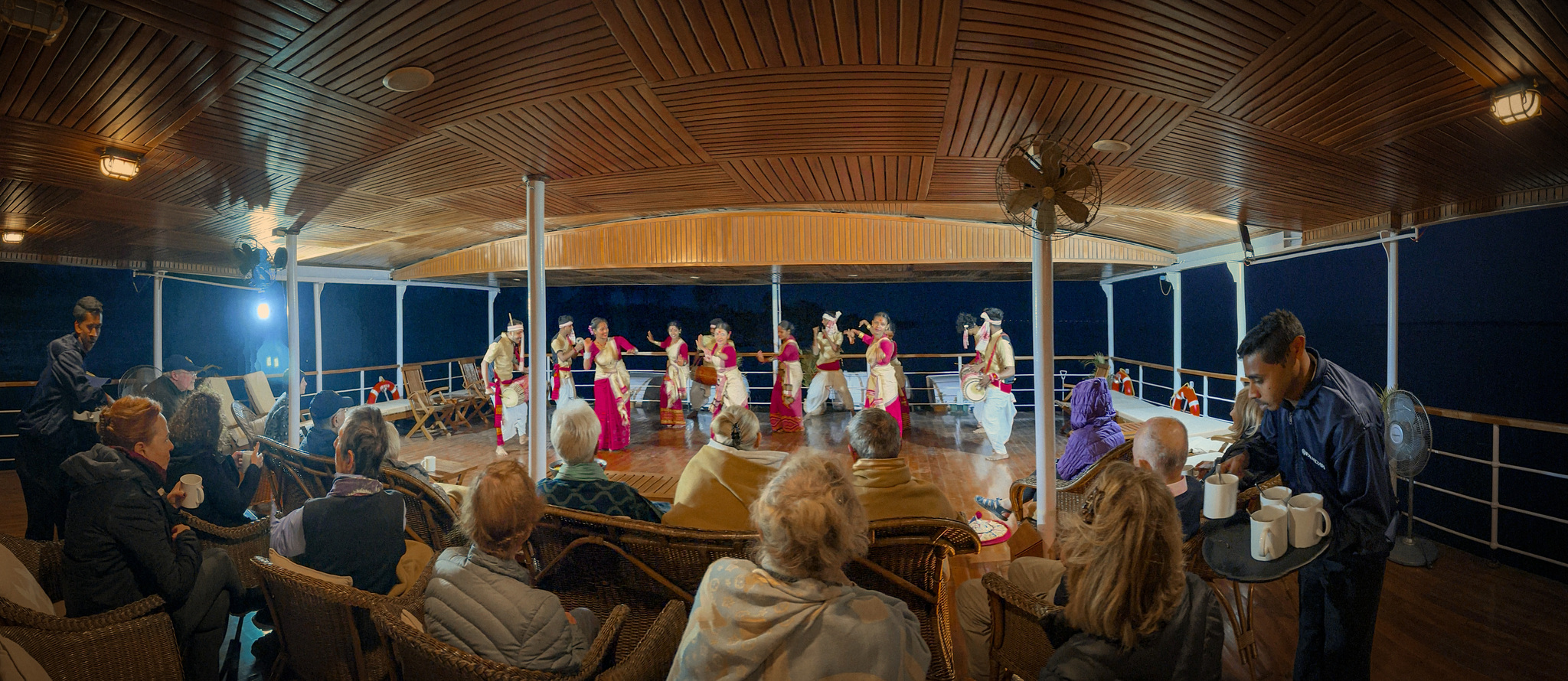 Dancers performing for guests on the ship at night