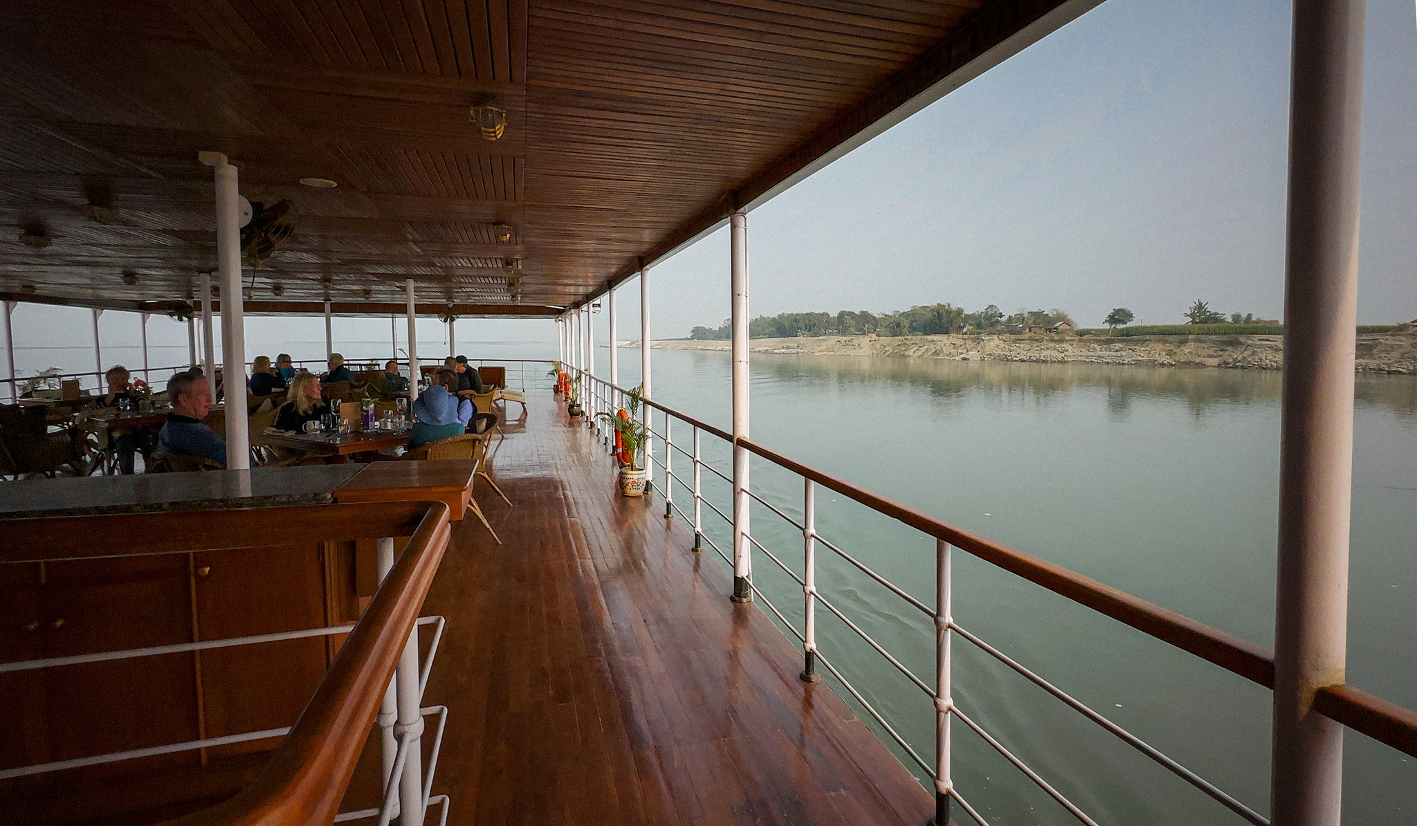 Tables set along the open side of the deck