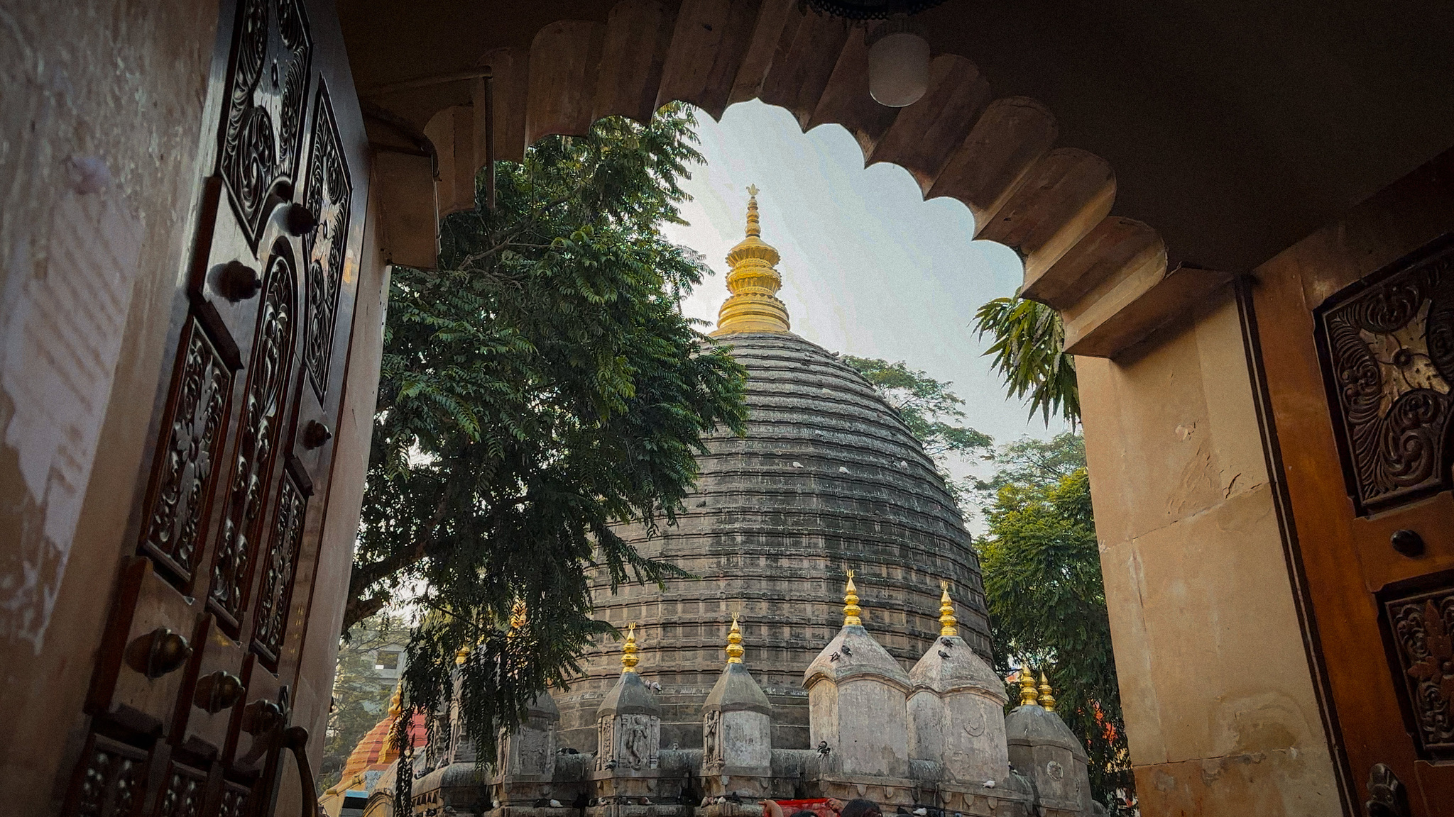 The Kamakhya temple seen through a carved doorway