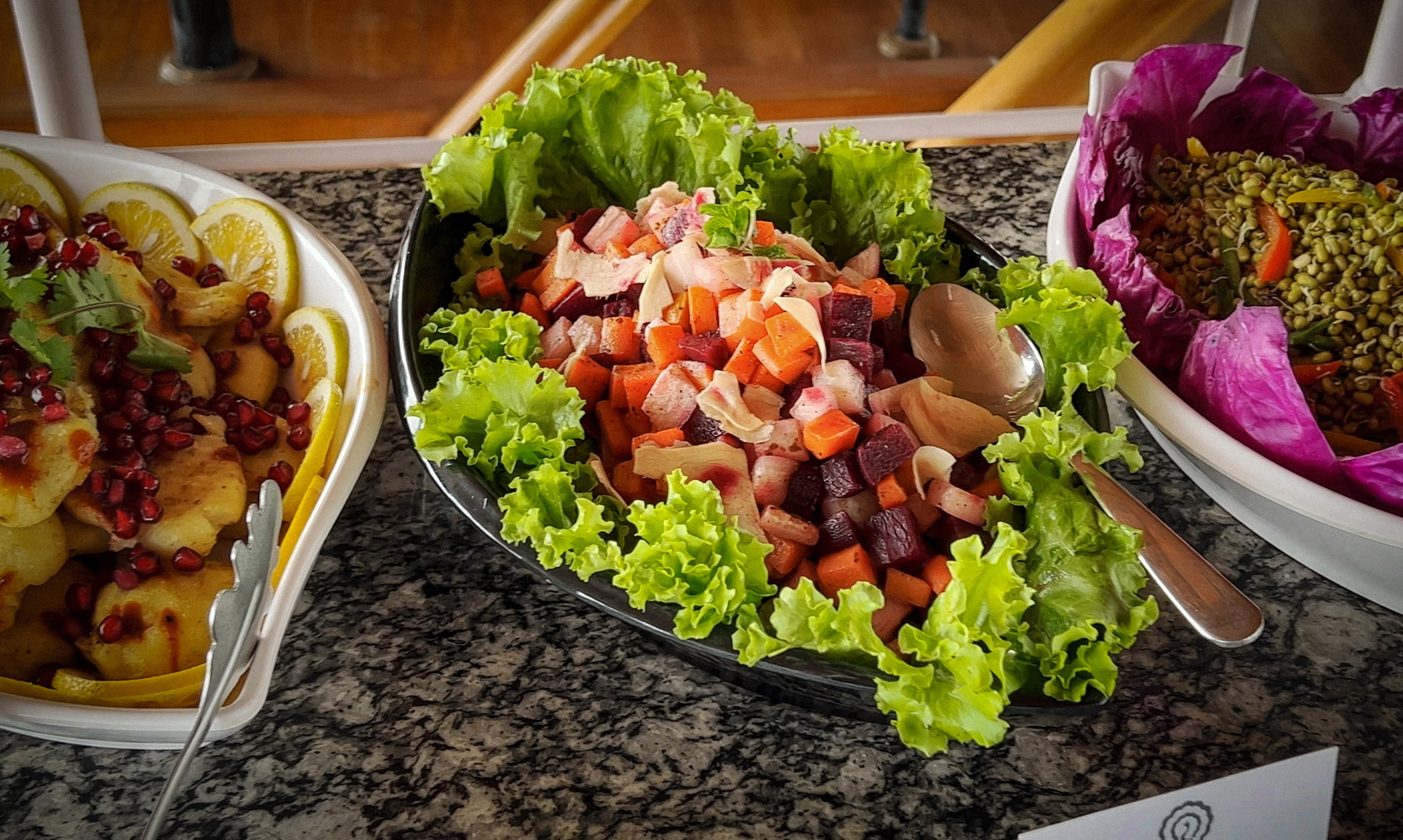 Salads and vegetables laid out at lunch