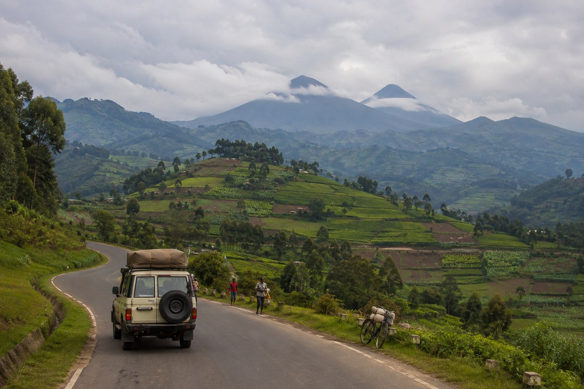 Descend Nyiragongo · return to Rwanda · drive to Uganda