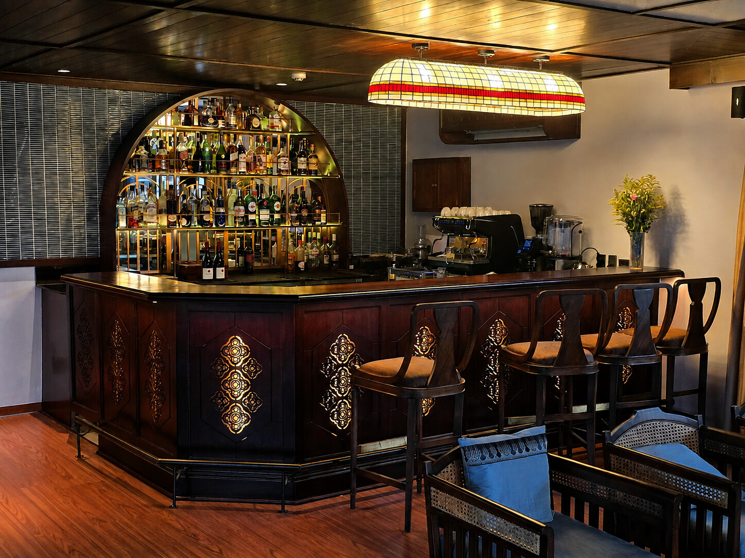 The bar, with its arched shelves and espresso machine