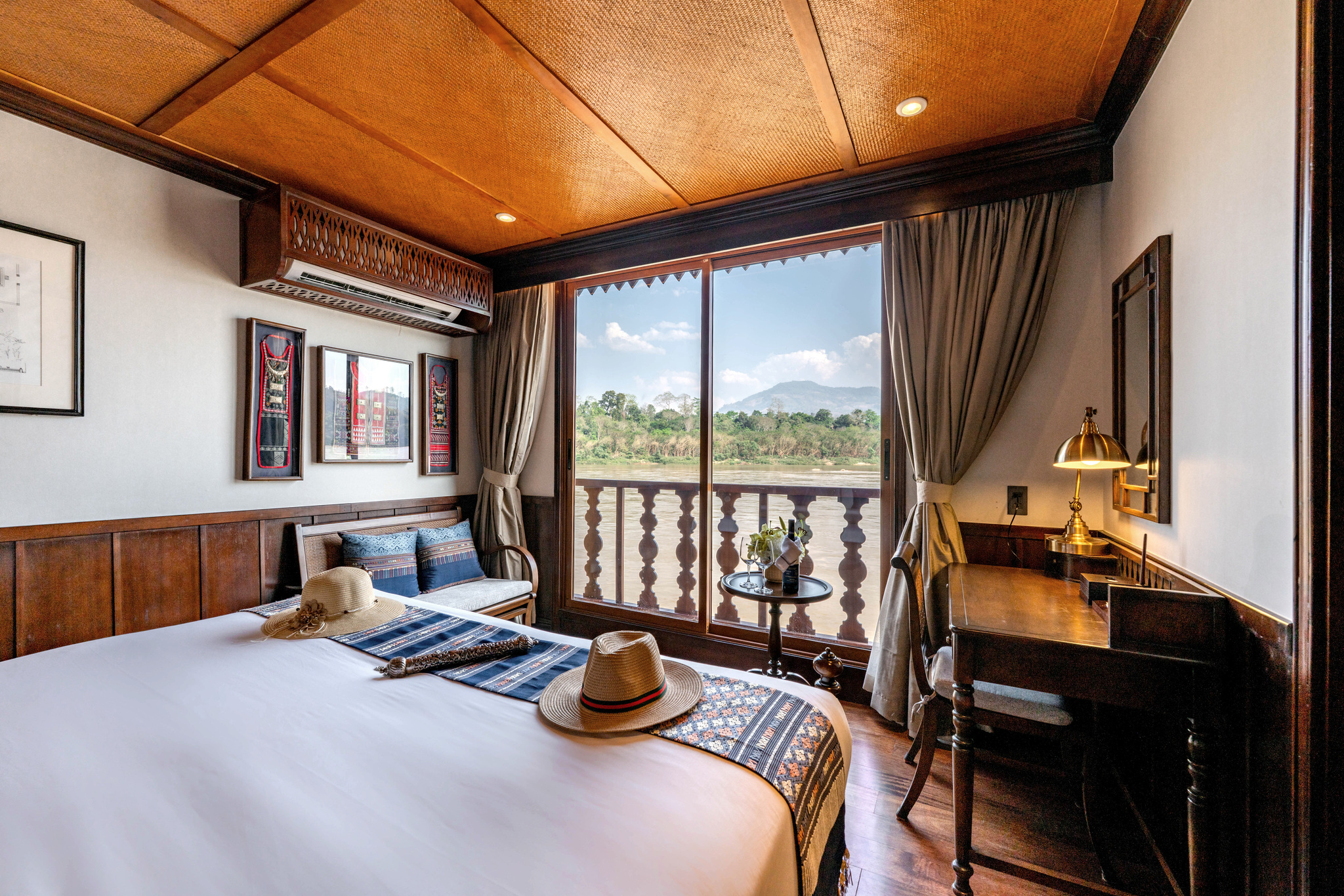 A stateroom and its French balcony, with the hills beyond