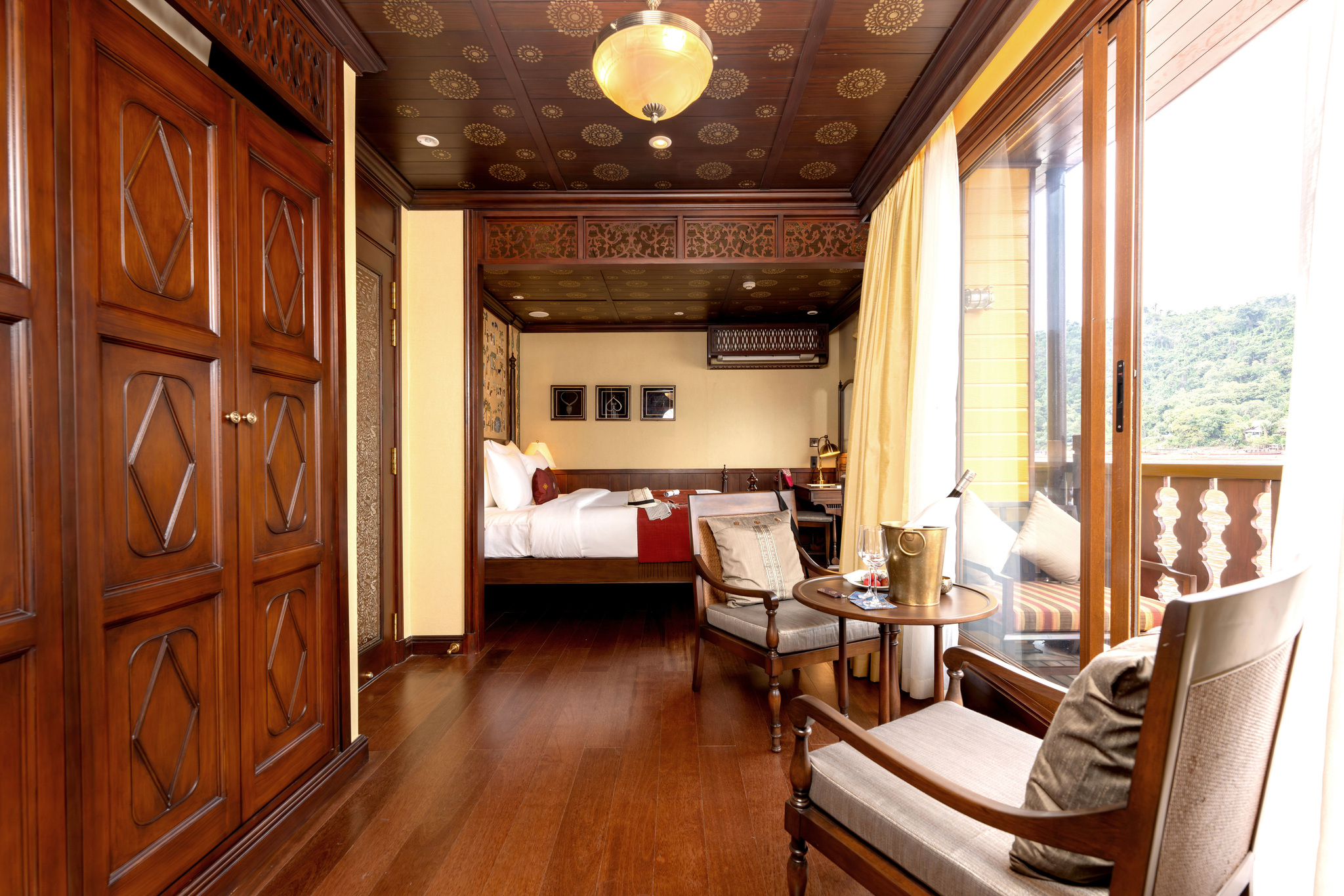 A suite's sitting area, bed and balcony