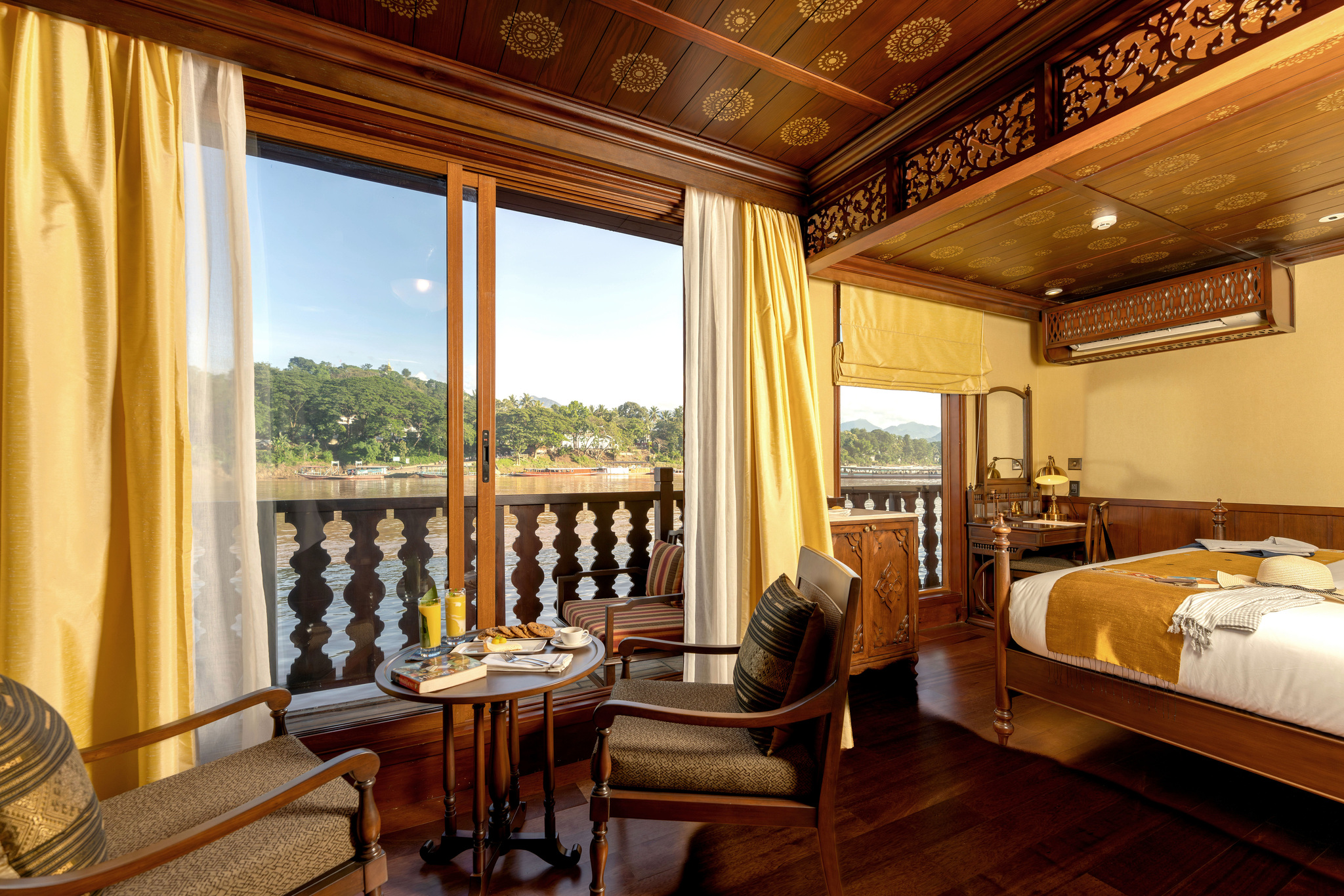 A suite with its sitting area by the balcony doors