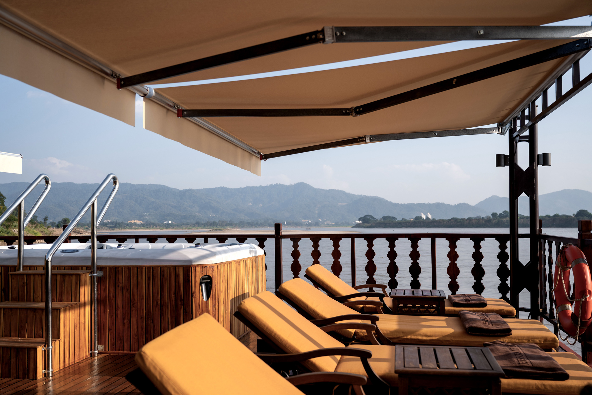 Sun loungers and the jacuzzi pool under the awning