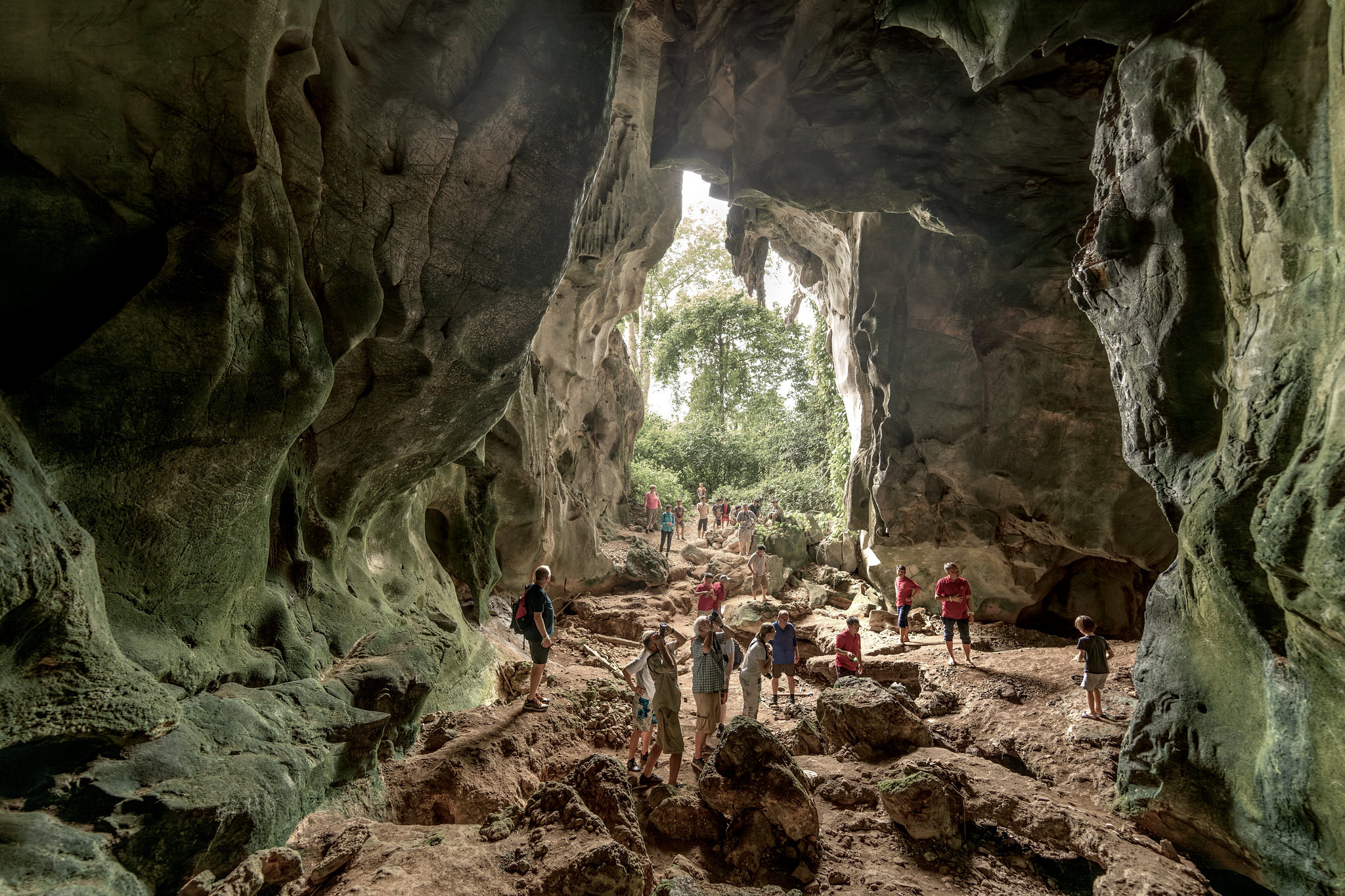 Guests exploring a limestone cave