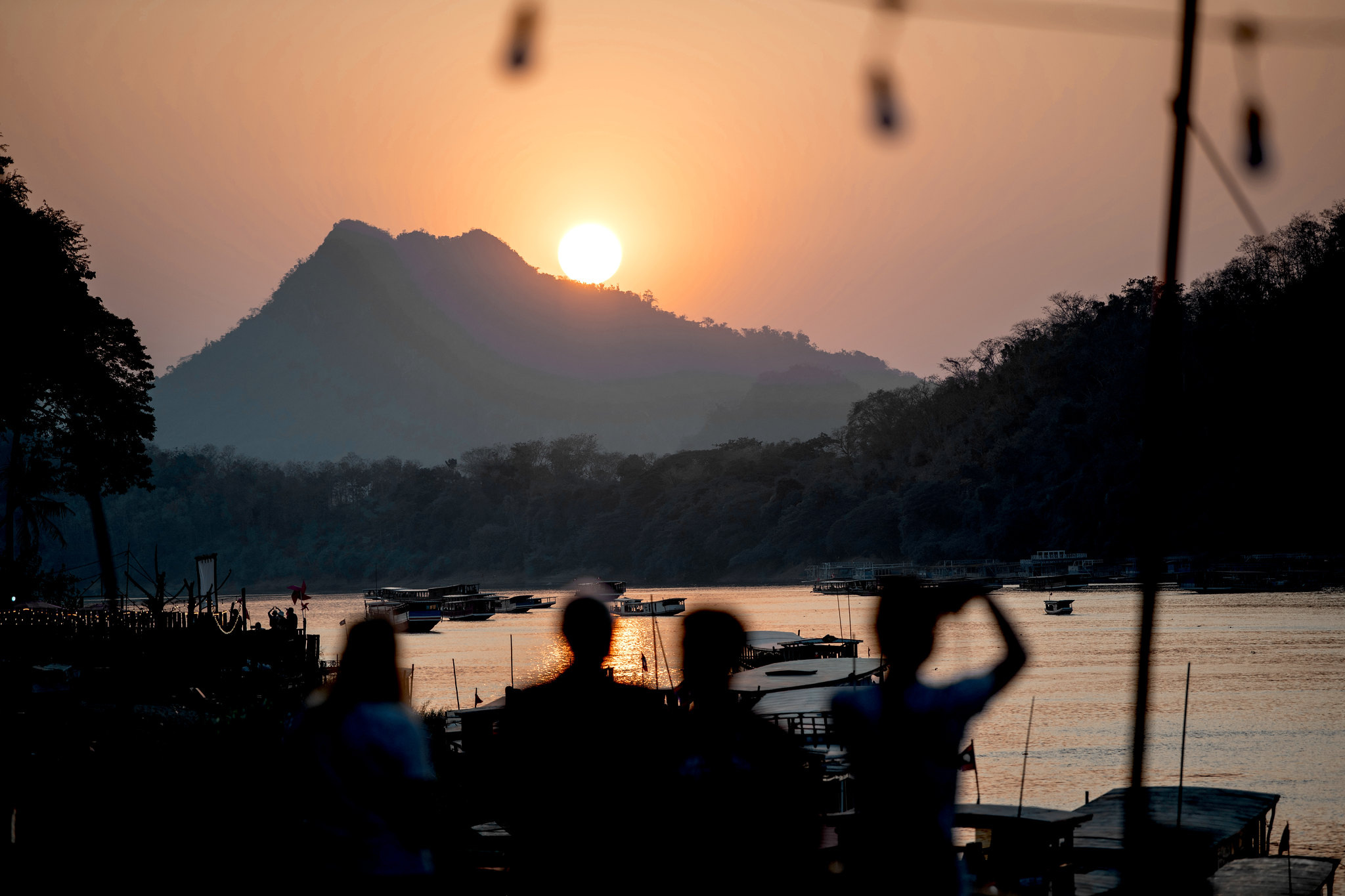 Watching the sun go down behind the hills from the riverbank