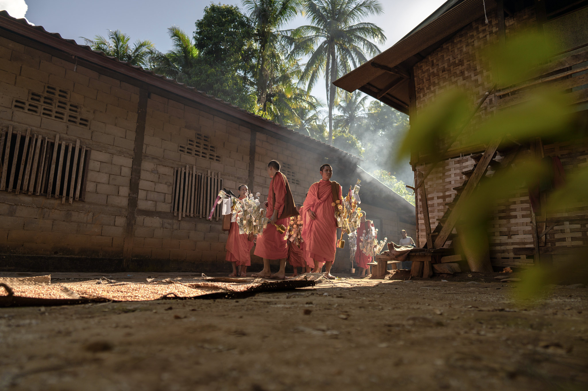 Monks walking through a village in the morning