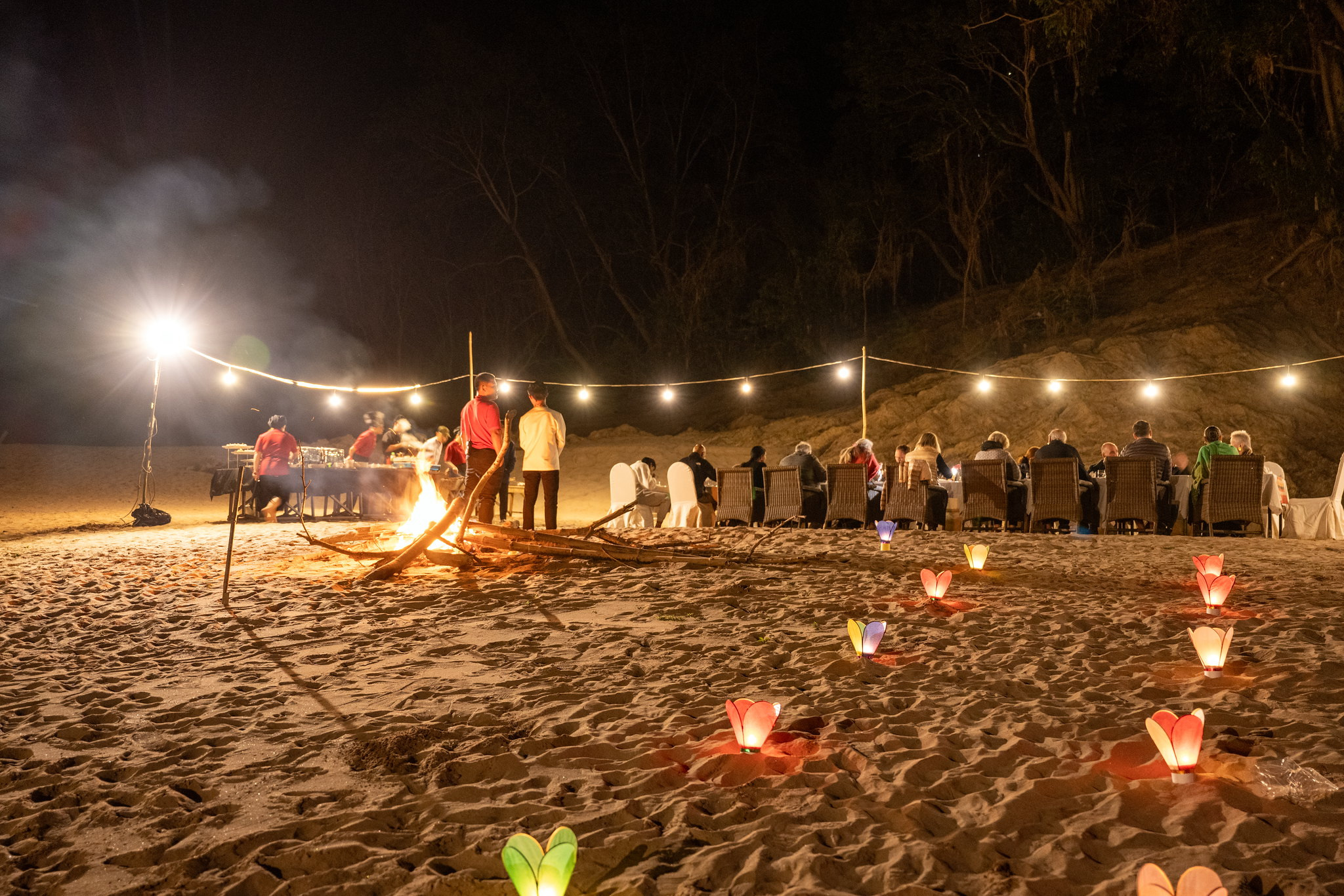 Dinner by lantern light on a Mekong sandbank