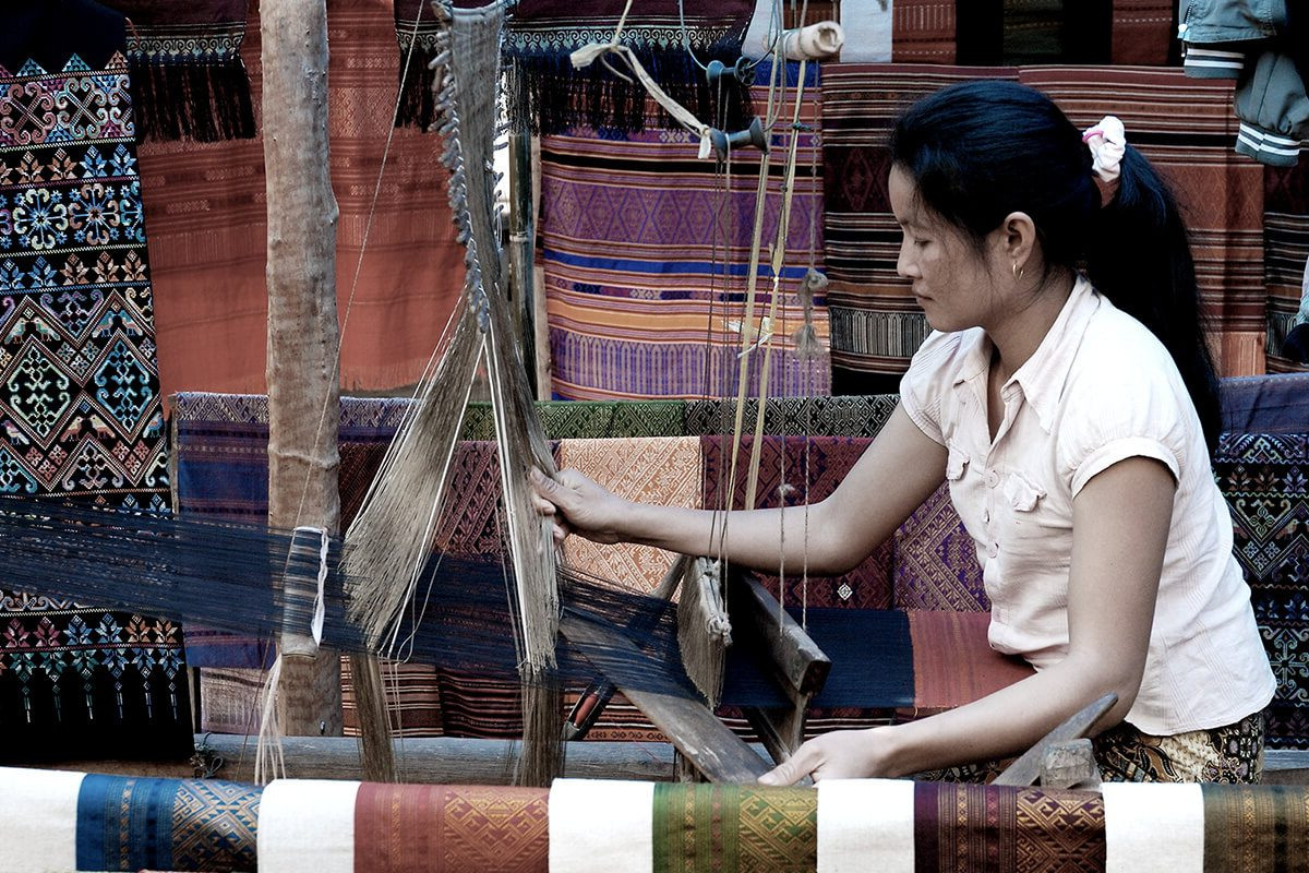 A weaver at a silk loom