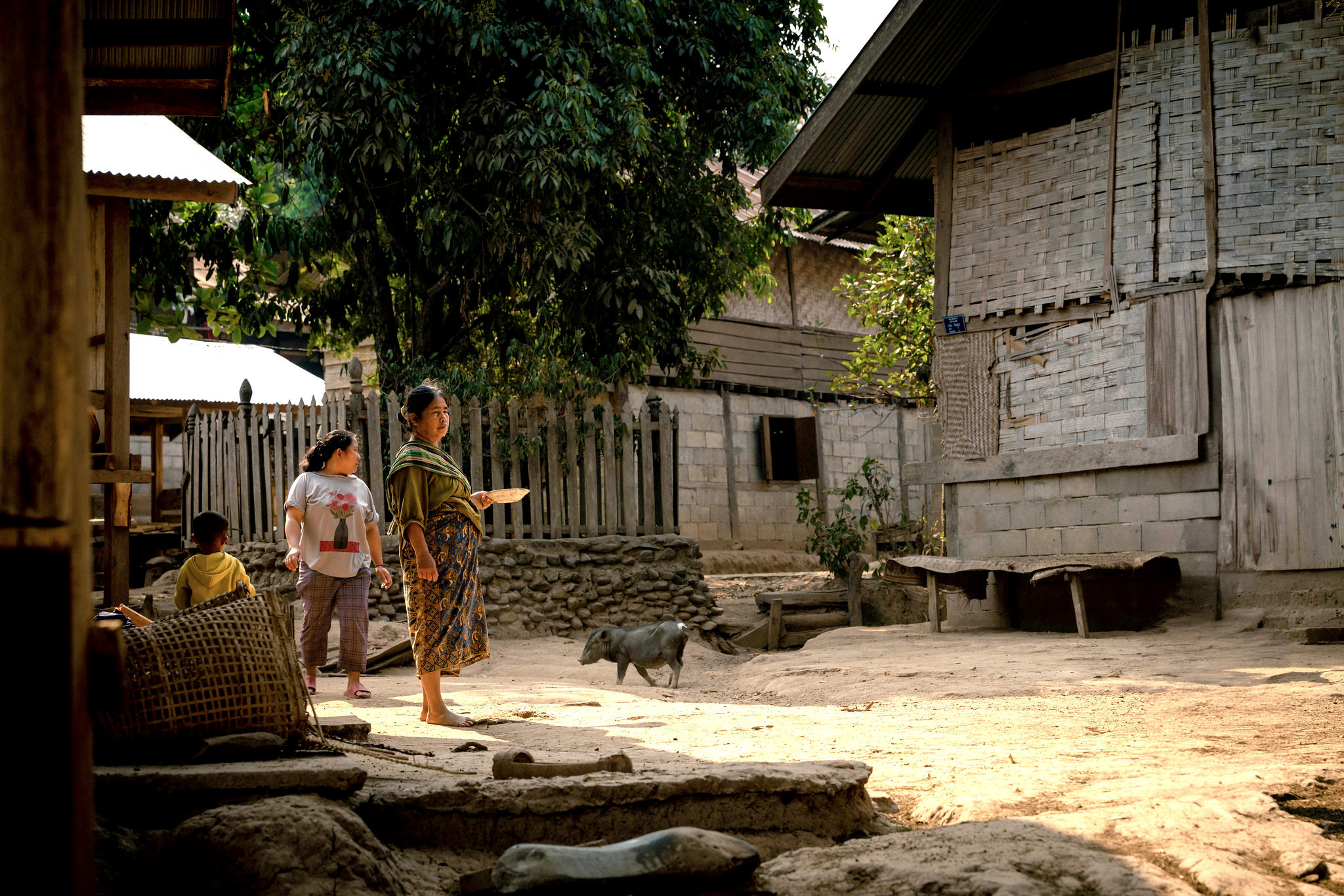 Villagers outside their houses in the afternoon