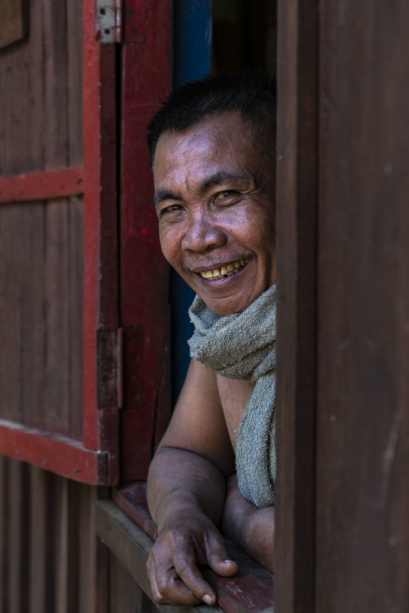 A villager smiling from his window