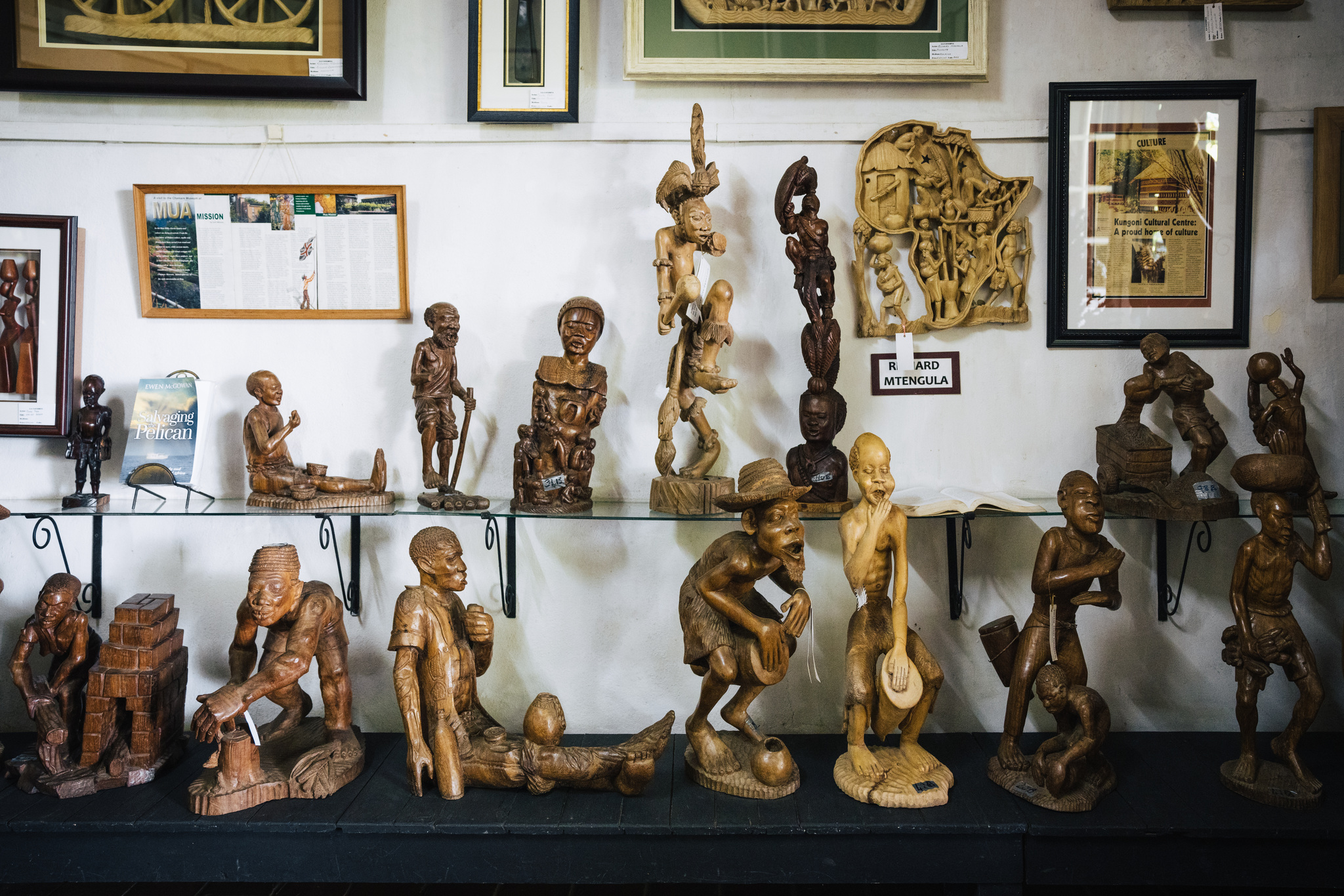 Carved wooden figures on the shelves of a Blantyre craft shop