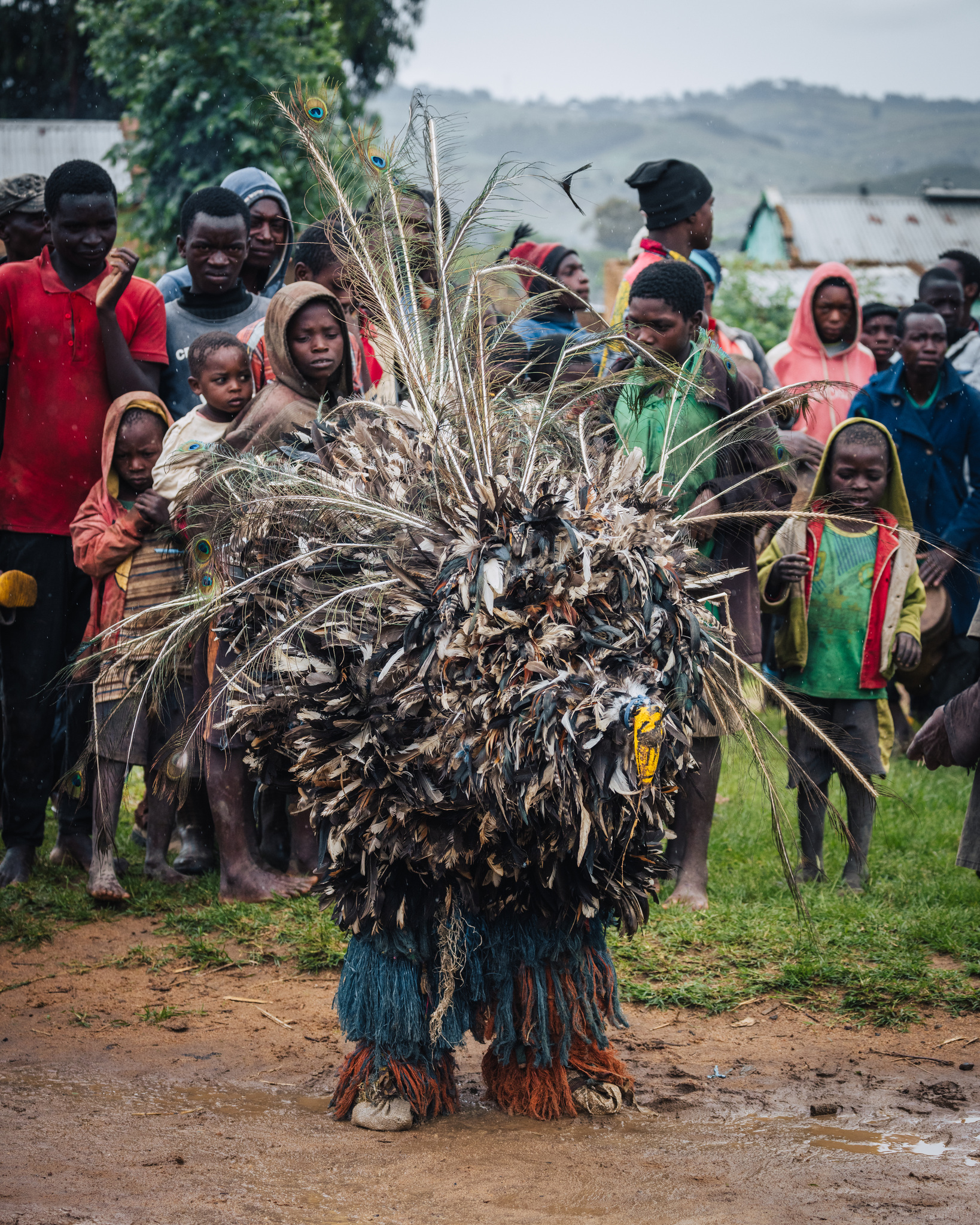 A Gule Wamkulu figure covered in feathers