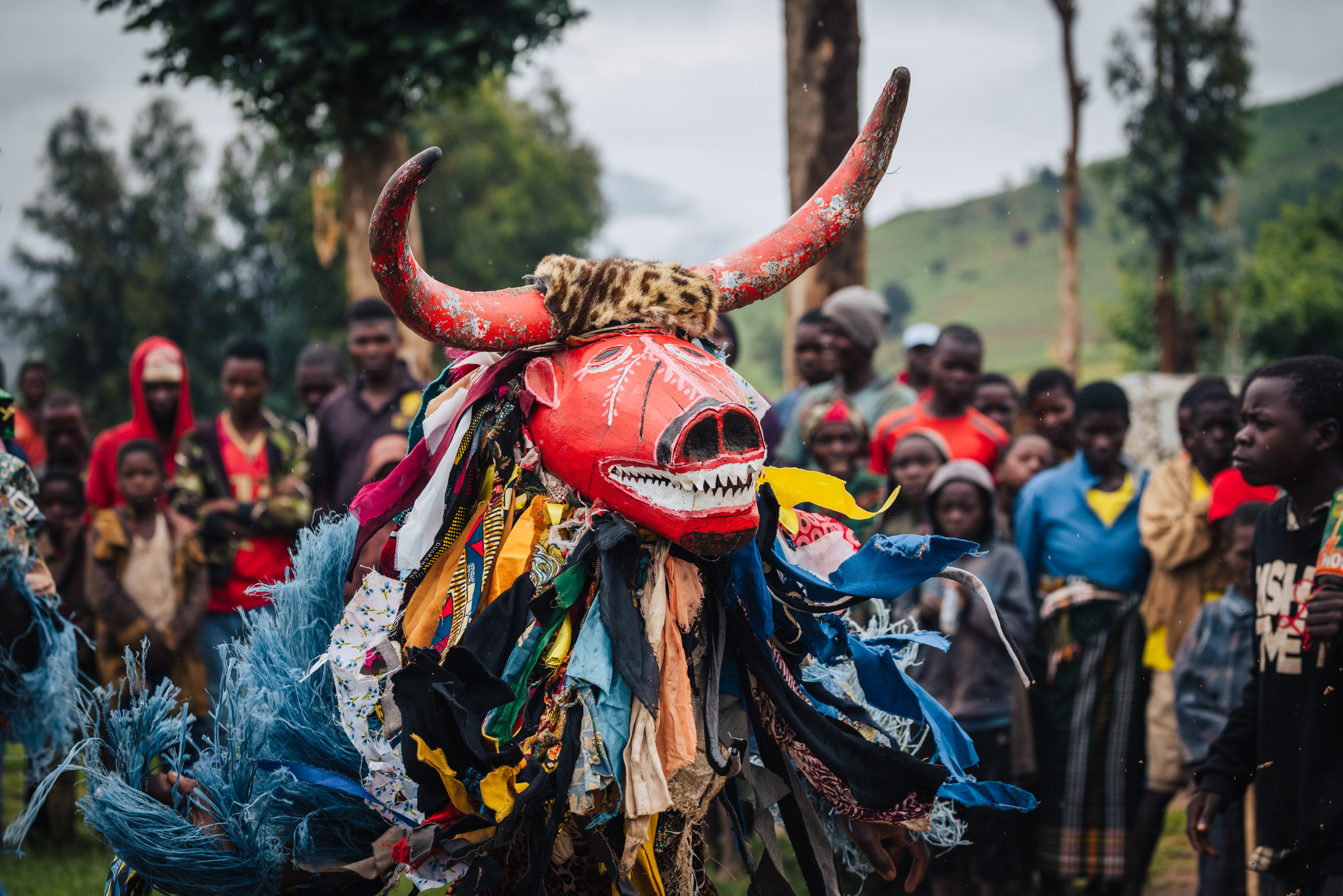 A Gule Wamkulu dancer in a red horned mask