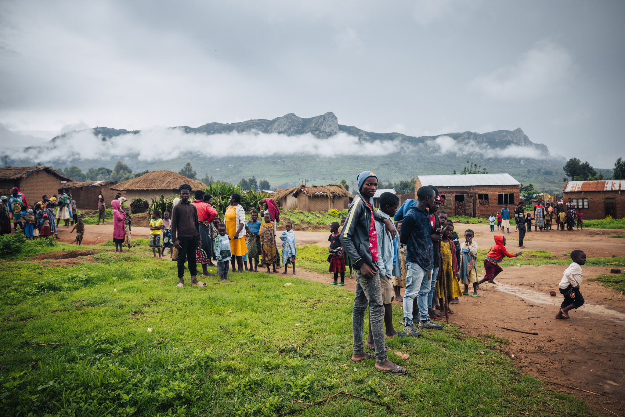A Chewa village below misty hills on the road to Lilongwe