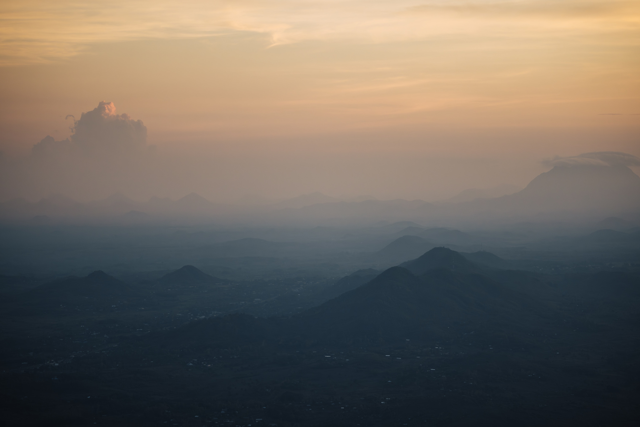 Hills fading into the evening haze below the Zomba Plateau